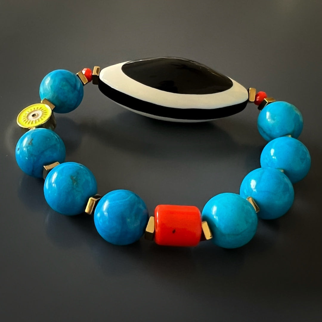 the Happiness Turquoise Eye Bracelet, showcasing the high-quality stretchy jewelry cord and the craftsmanship of the handmade piece, emphasizing its durability and comfortable fit.