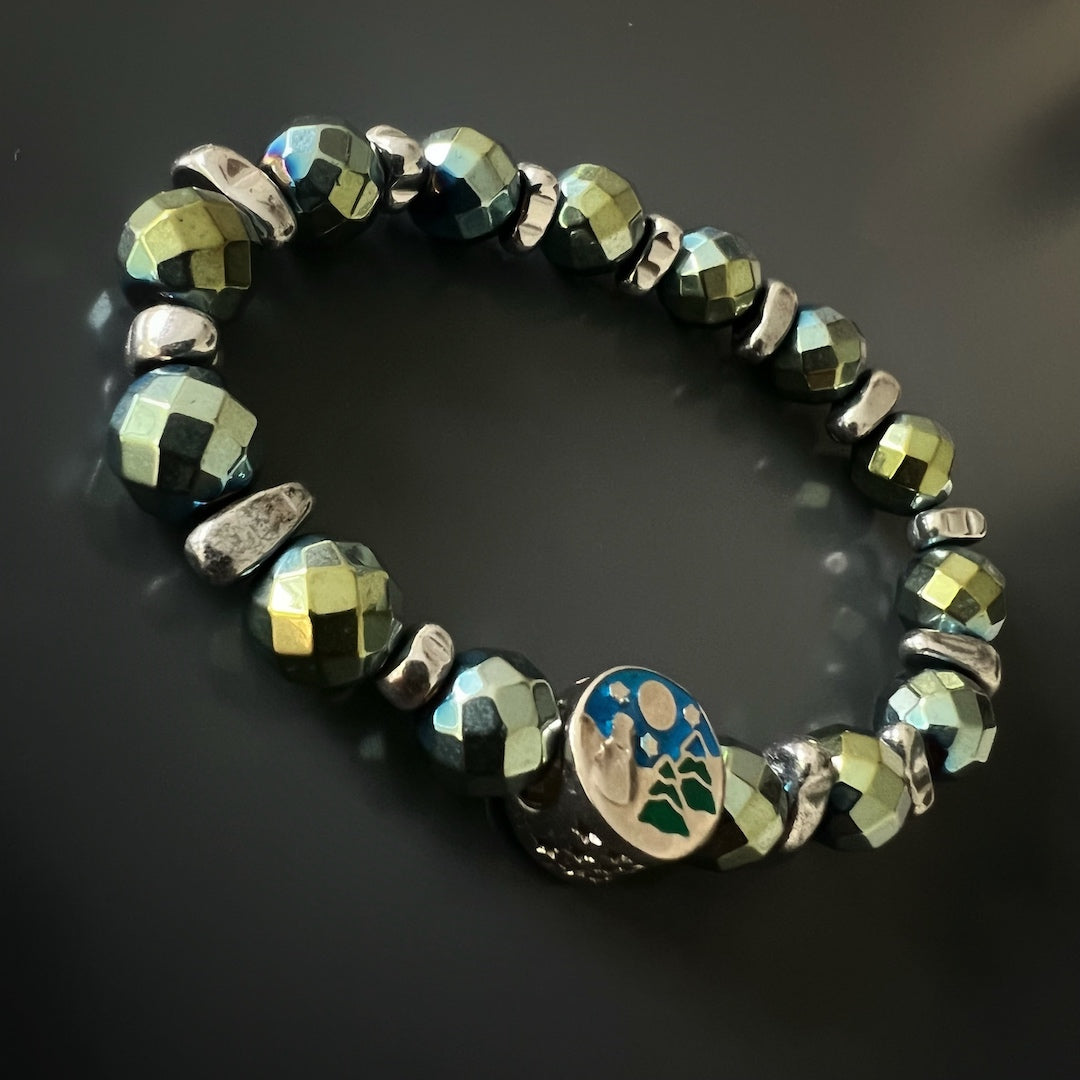 Elevate your style with the minimalist design of the Hematite Energy Bracelet, adorned with a Sterling silver star charm and Hematite gemstones.