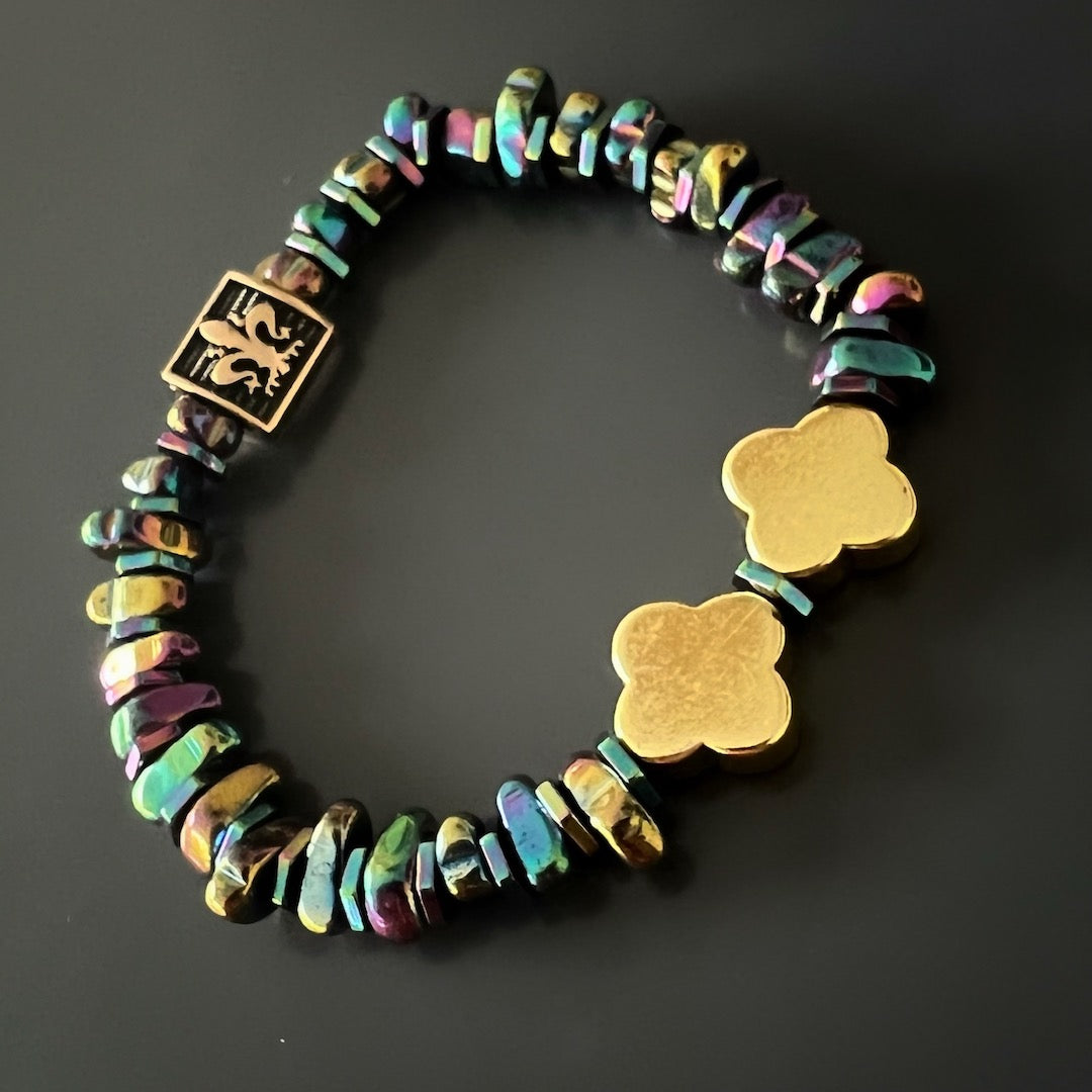 Discover the beauty of the Hematite Floral Bracelet, featuring its unique combination of nugget Hematite stones and gold floral beads.