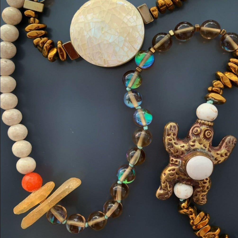 Embrace the unique design of the Turtle Necklace, showcasing the beauty of bronze and silver pendants.