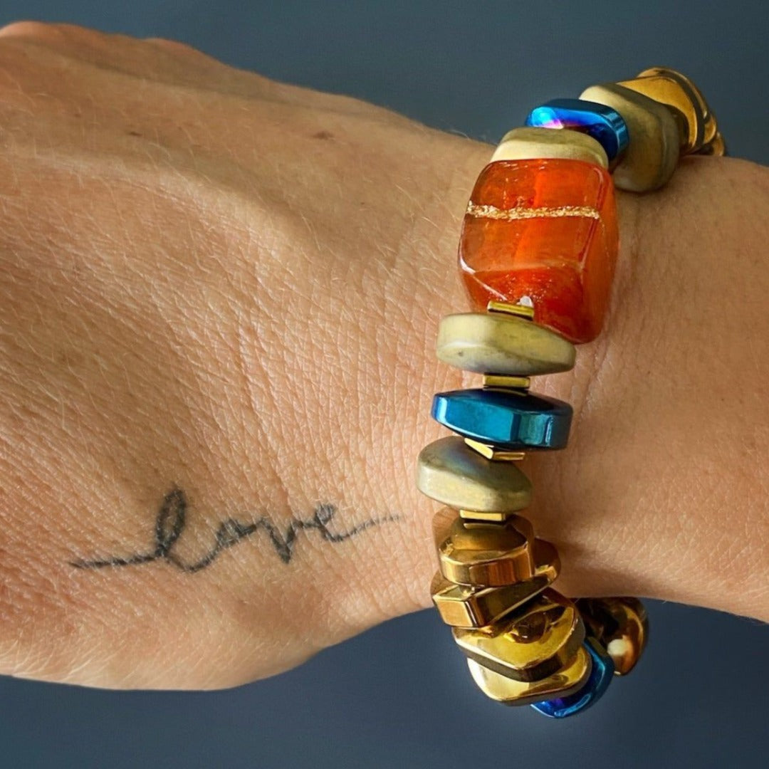 Another image of a model wearing the Karma Hematite Bracelet, highlighting its beautiful combination of colors and the statement it makes as a fashionable accessory.