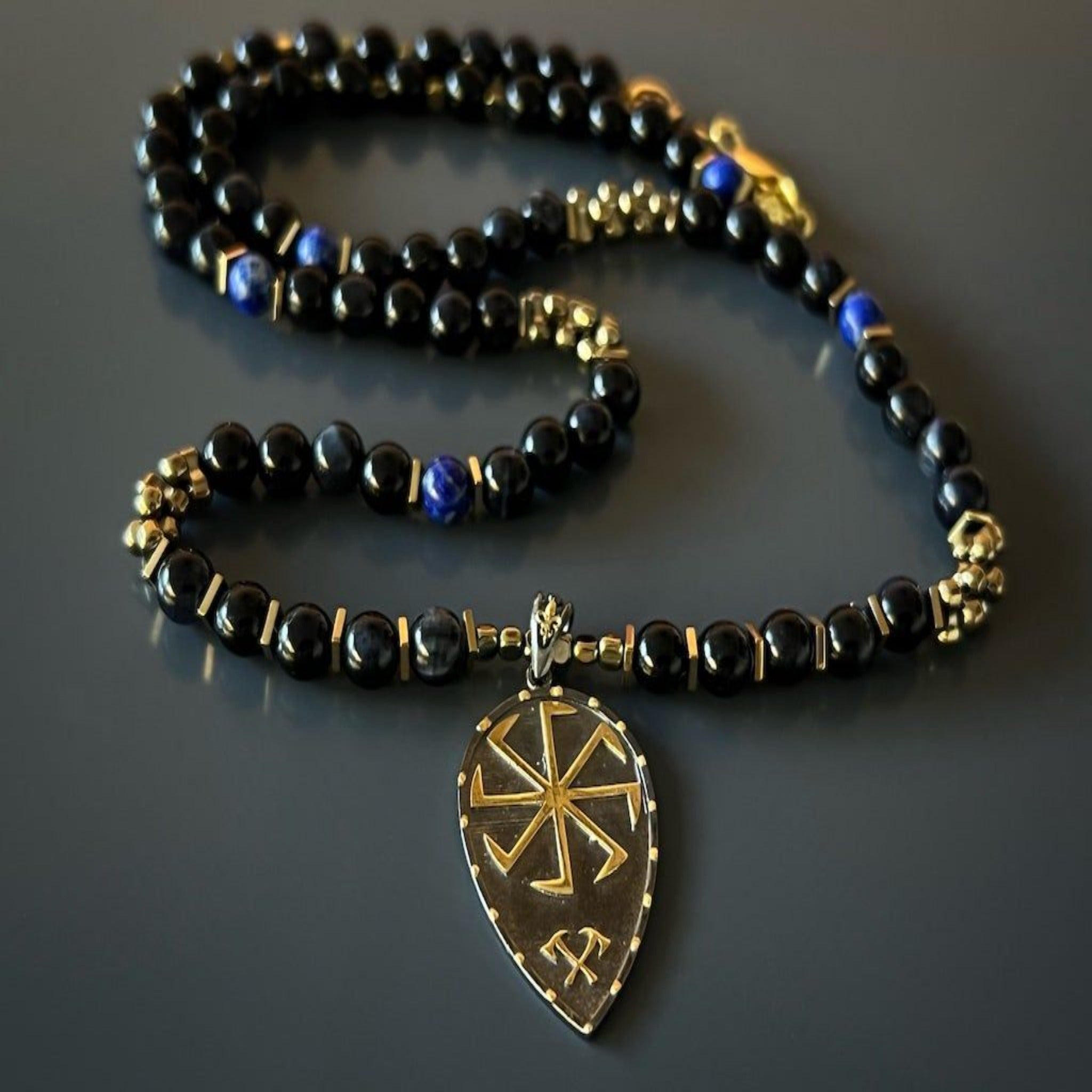 The Kolovrat Sun Cross Necklace displayed, capturing attention with its unique combination of spiritual symbols and natural gemstones.