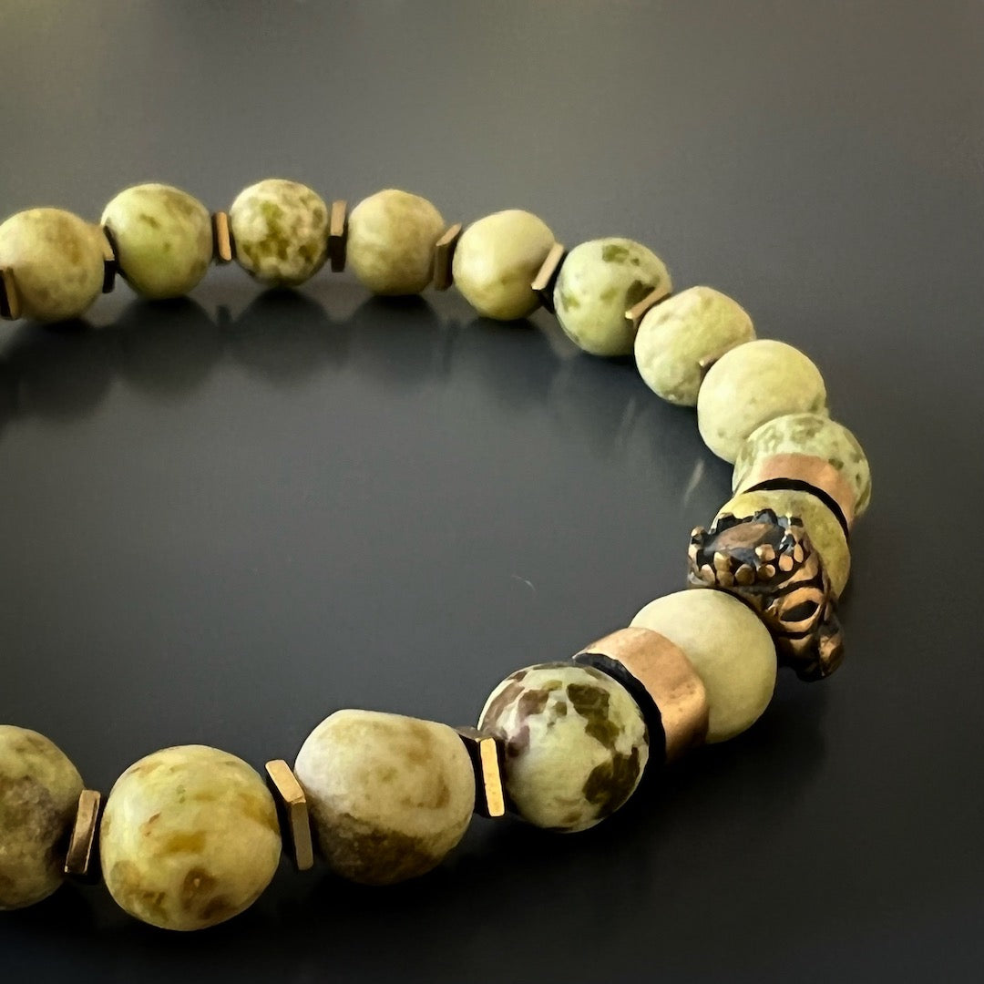 Find your inner roar with the Lion King Bracelet, featuring matte Tree Agate stone beads and a captivating Lion King accent bead.