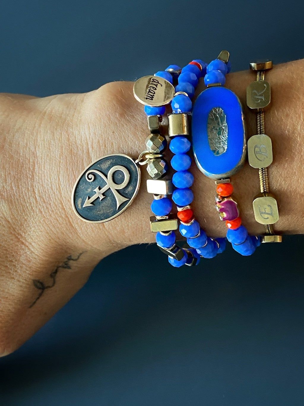 Enhance your style with the Magical Symbols Bracelet Set, as seen on the model, adding a touch of magic and symbolism to any outfit.