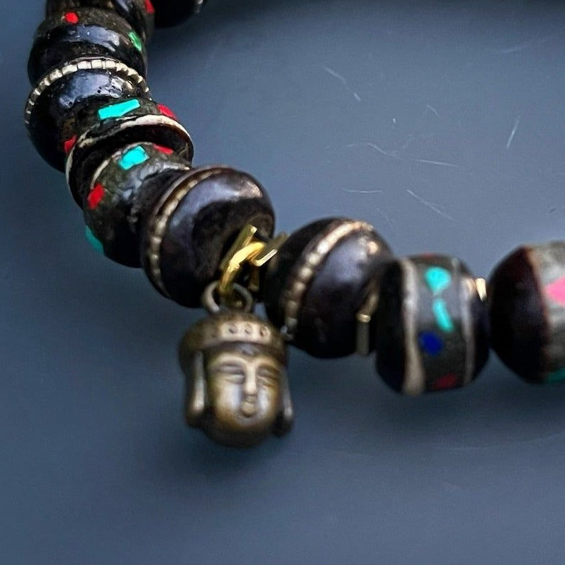 Embrace your spiritual journey with the Meditation Bracelet, adorned with Nepal seed beads, hematite spacers, and a bronze Buddha charm.