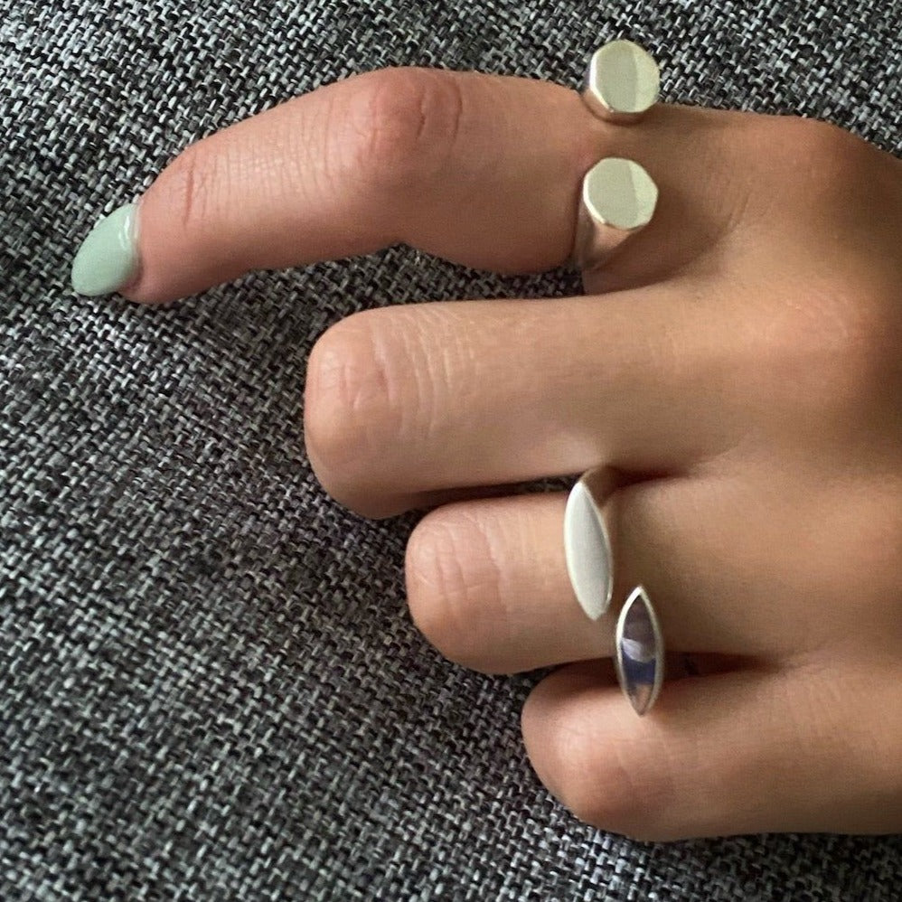 Enhance your style with the Minimalist Women's Ring, as beautifully showcased by the model, adding a touch of elegance to any outfit.