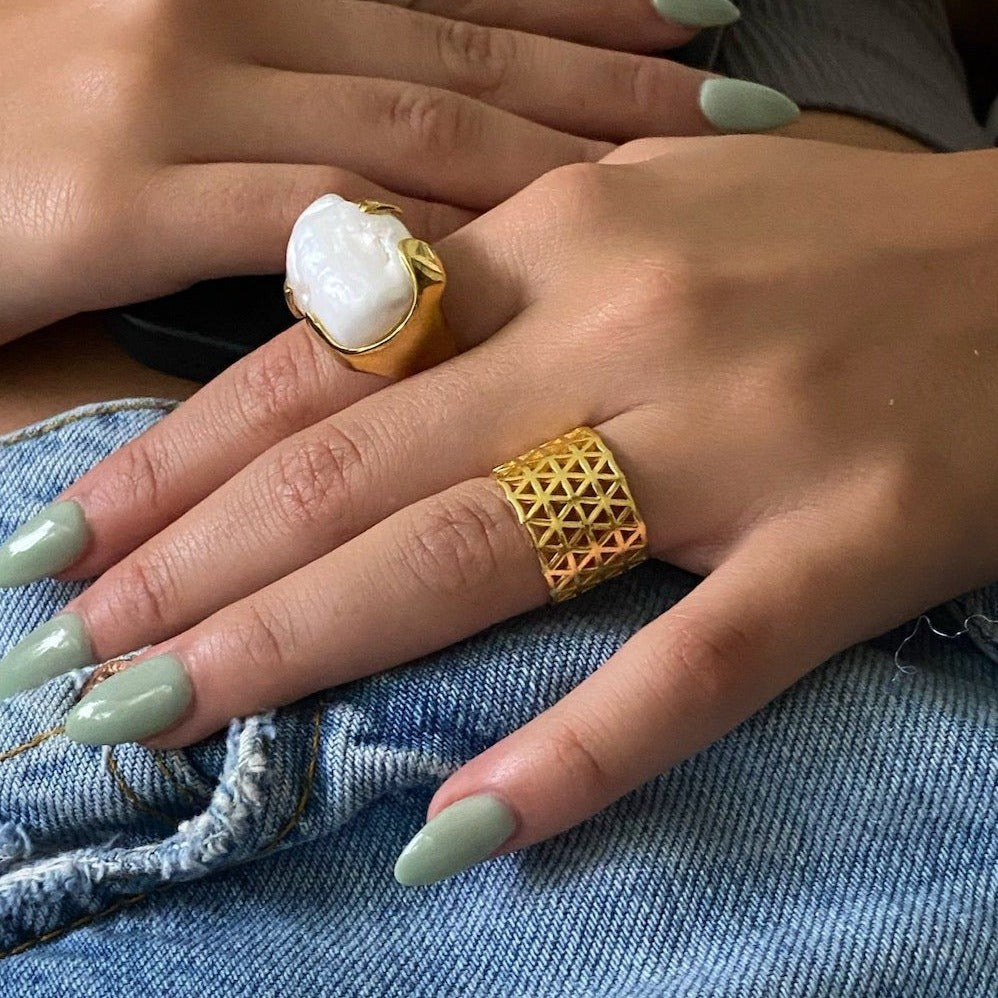 The model showcases her confidence while wearing the Modern Gold Ring, exuding style and sophistication.