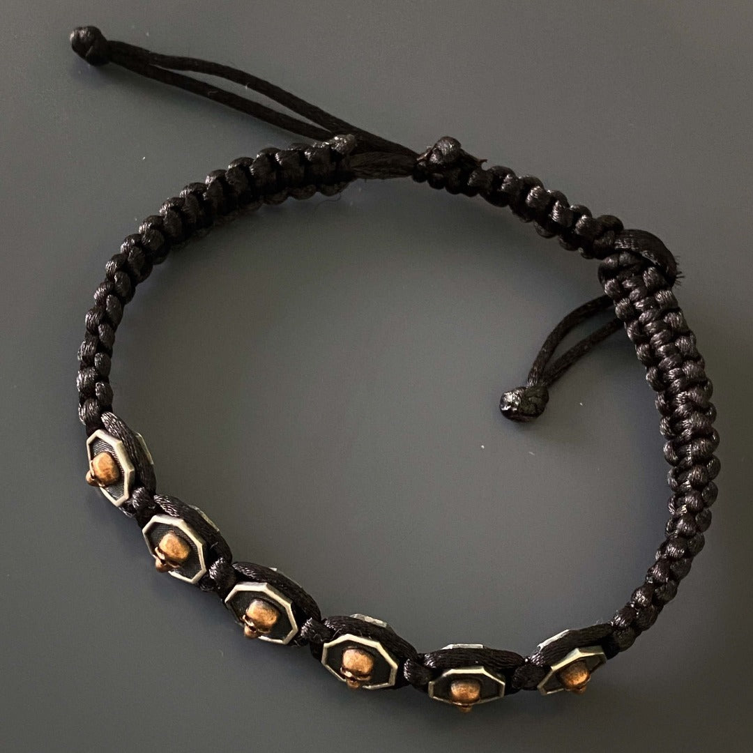 A closer look at the black rope and silver skull charm on the Black Skull Men Woven Bracelet