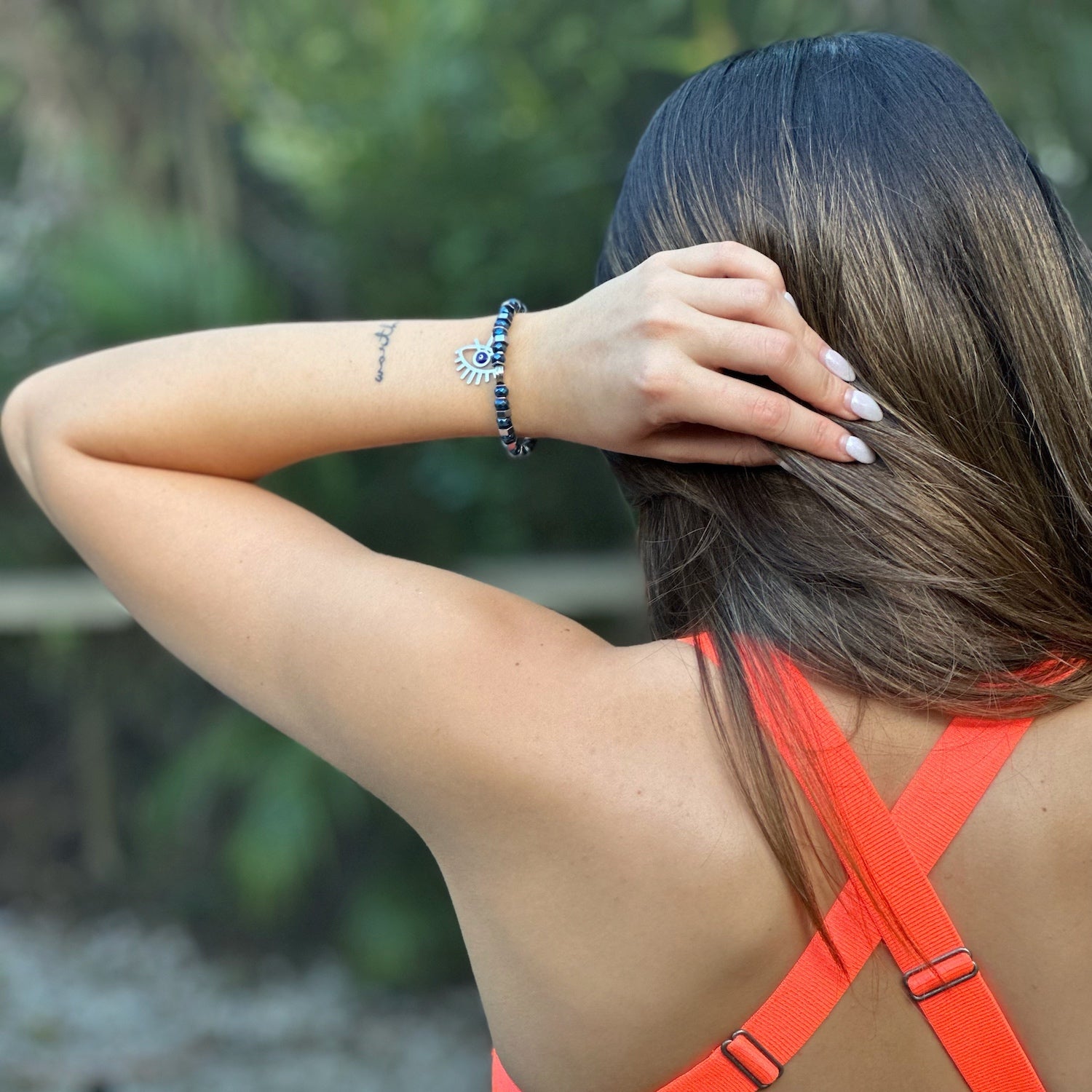 See the Nazar Bracelet shine on the hand model, showcasing its unique combination of beauty, symbolism, and stylish design.