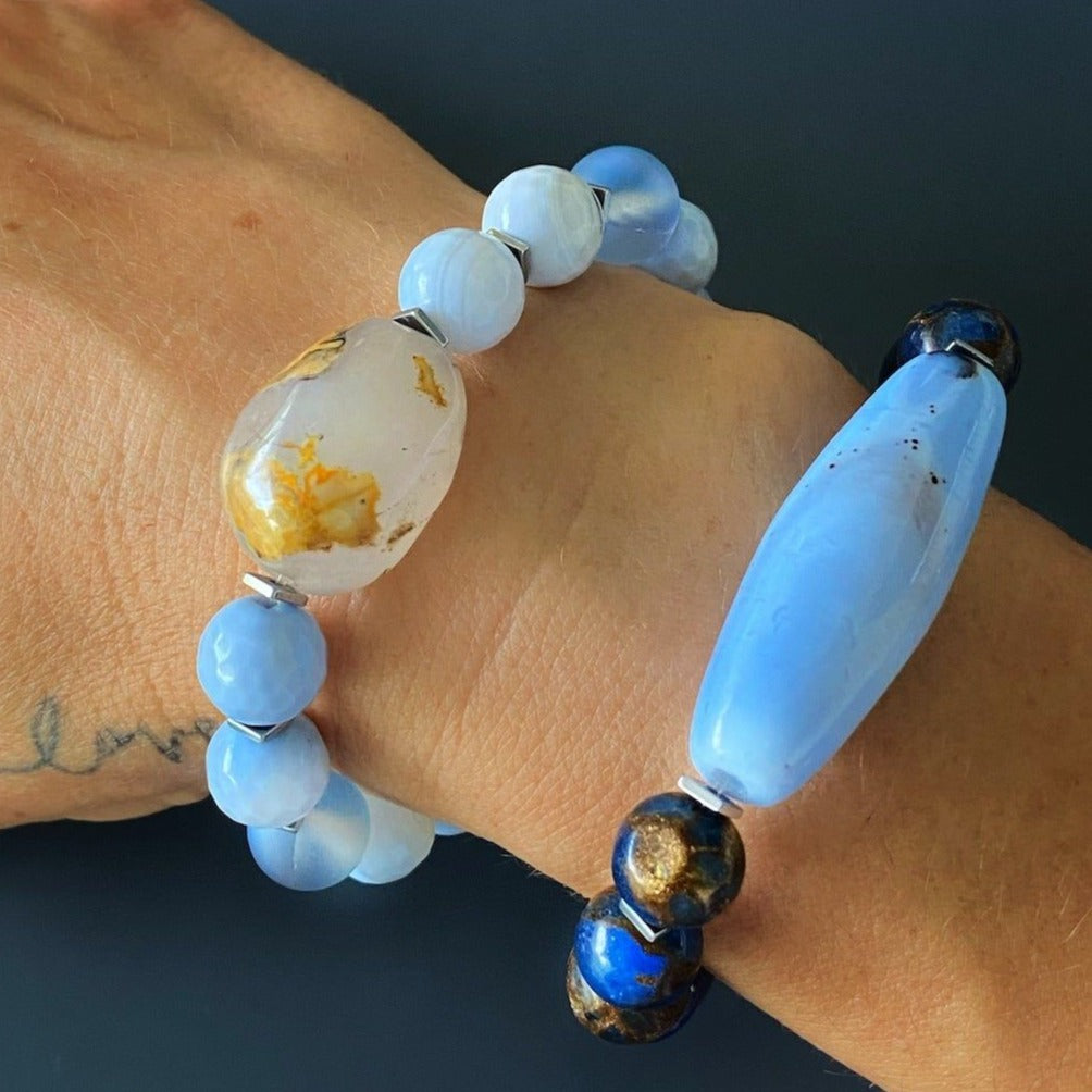 Hand model showcases the elegance of the Ocean Inner Peace Bracelet Set, radiating a sense of serenity and inner peace.