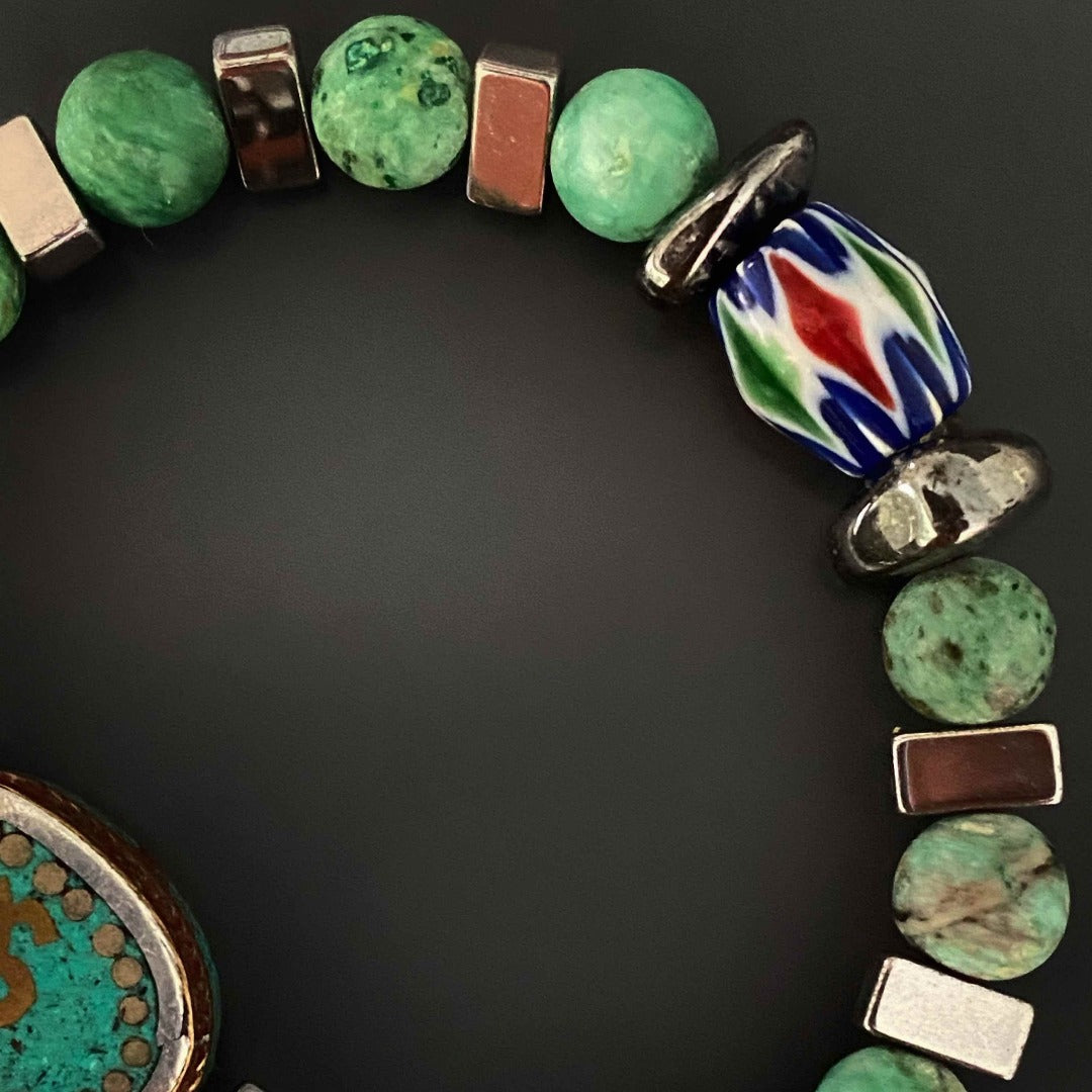 Admire the craftsmanship of the Om Mystic Bracelet, combining natural elements and a symbolic Om Mantra charm.