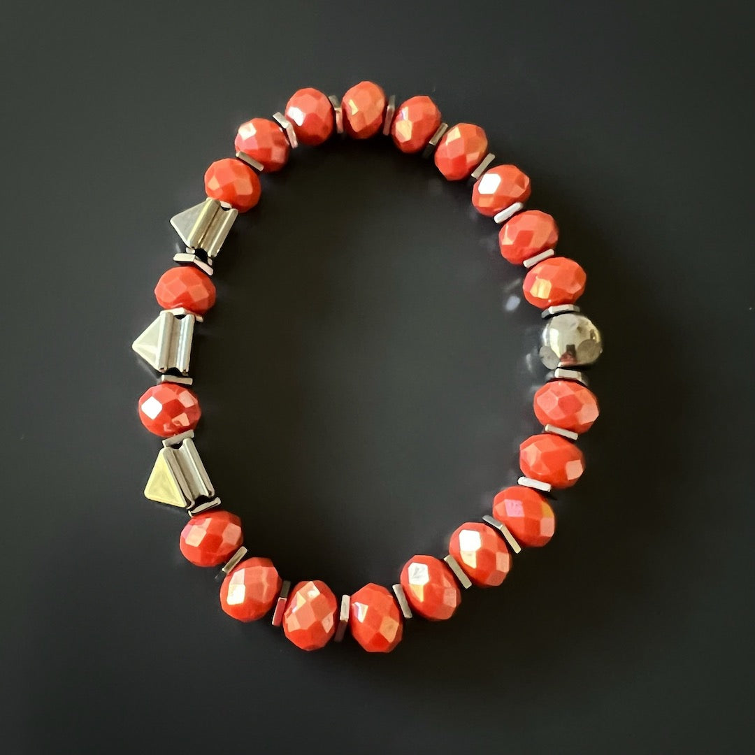 Channel positivity and vitality with the Orange Energy Bracelet, adorned with vibrant orange crystal beads and silver hematite stone beads.