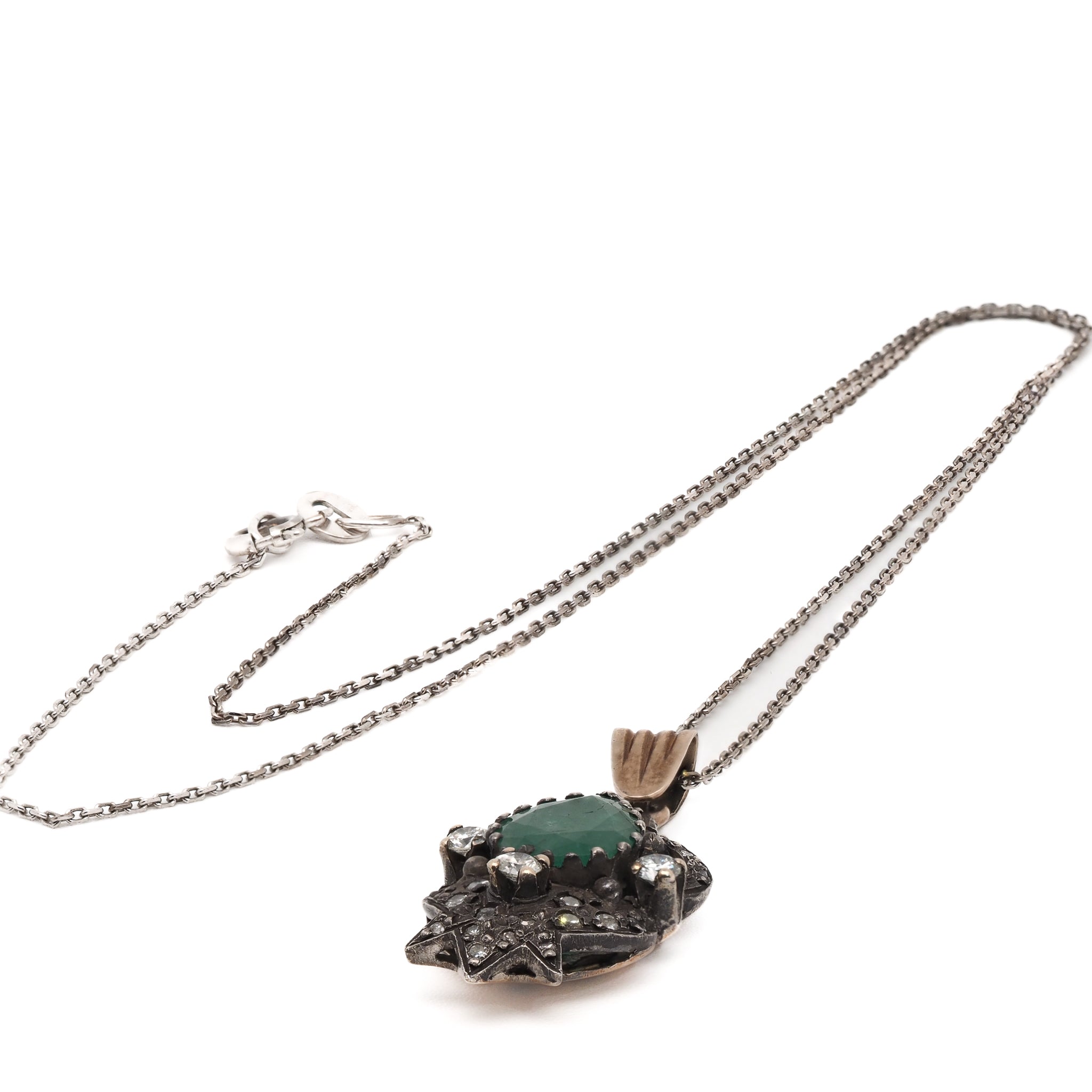 Timeless Beauty - The natural emerald and diamonds exude elegance and charm.