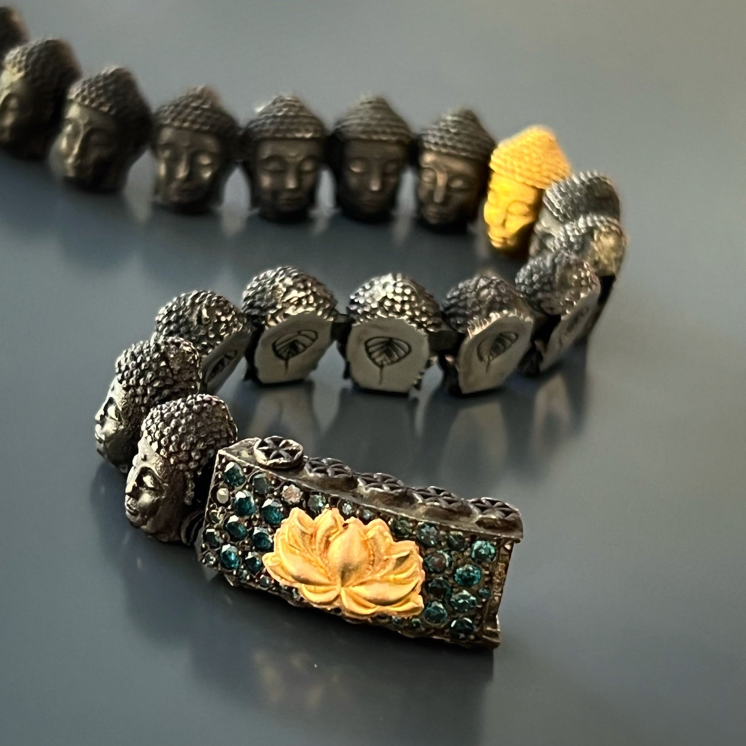 Symbol of Enlightenment - Gold Lotus Buddha Bracelet with captivating sparkle.