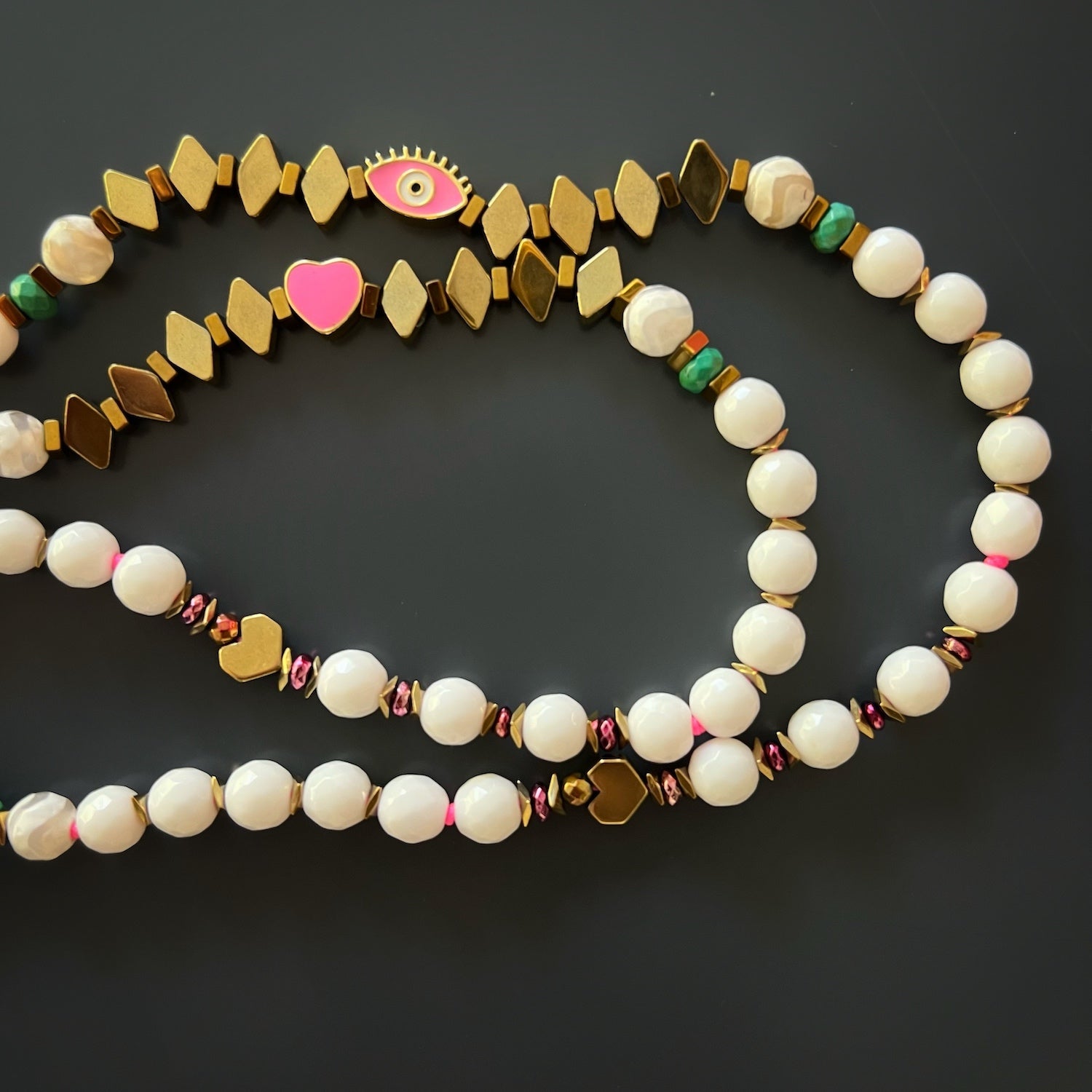 Power Of Love Necklace with its long length, perfect for layering or wearing as a statement piece.
