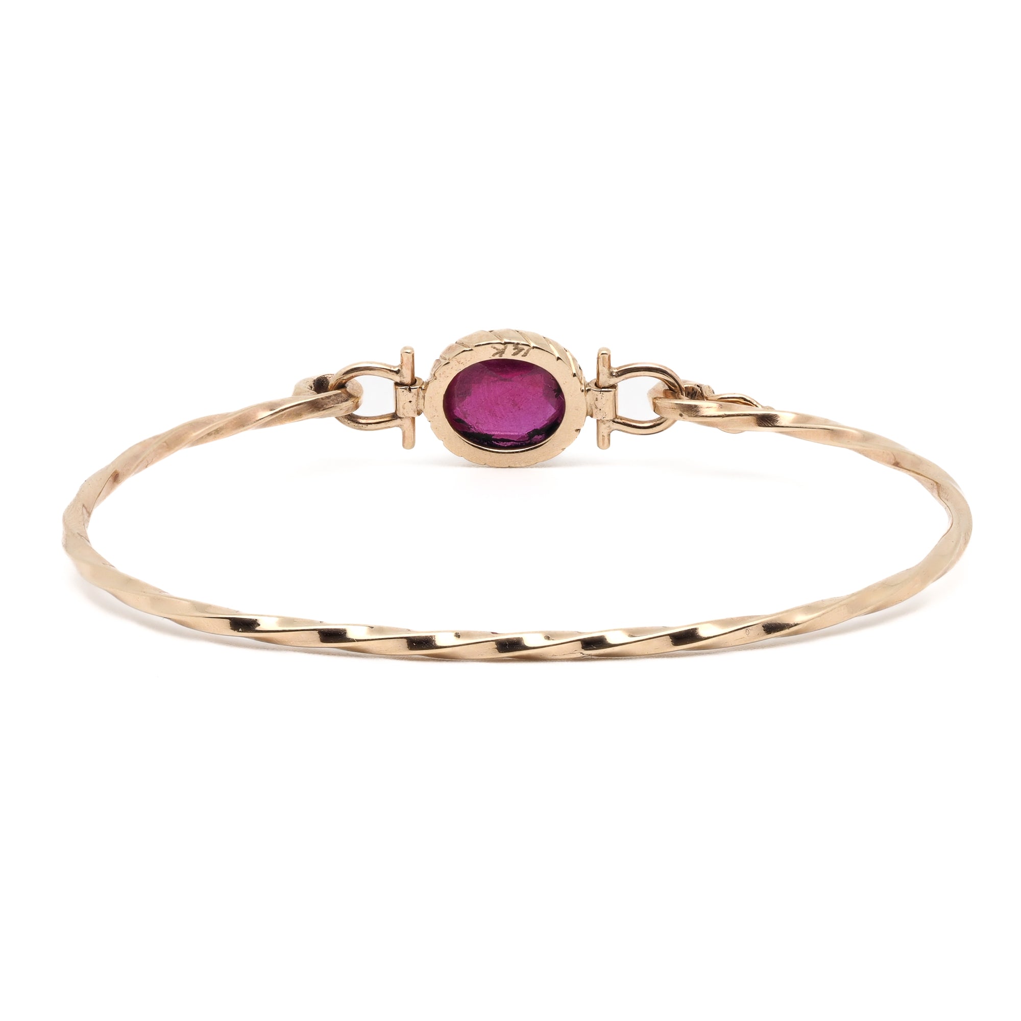 Elegant Gold Bracelet with Ruby - A captivating image displaying the elegant and timeless Gold Ruby Bangle Bracelet adorned with a beautiful natural Ruby gemstone.