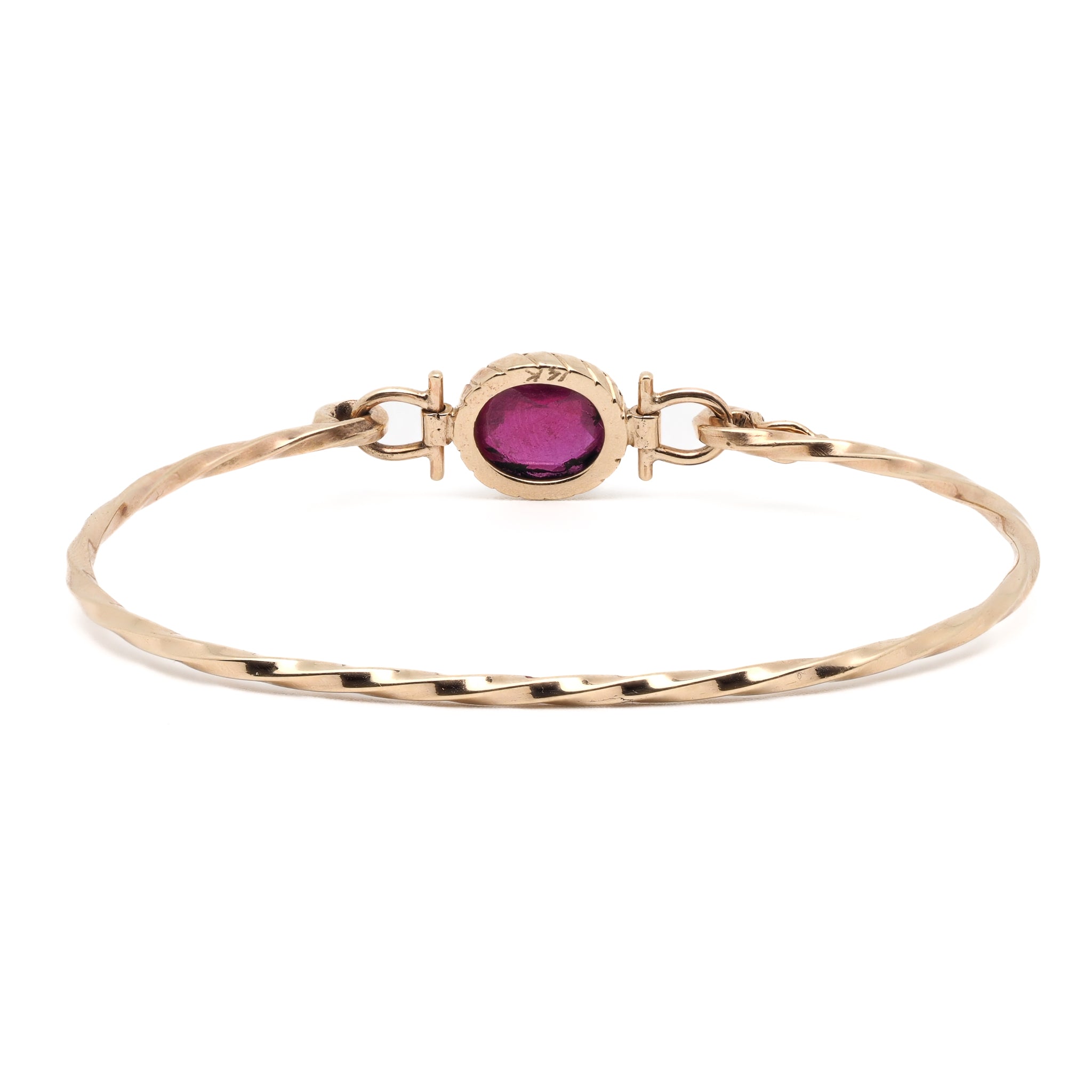 Elegant Gold Bracelet with Ruby - A captivating image displaying the elegant and timeless Gold Ruby Bangle Bracelet adorned with a beautiful natural Ruby gemstone.