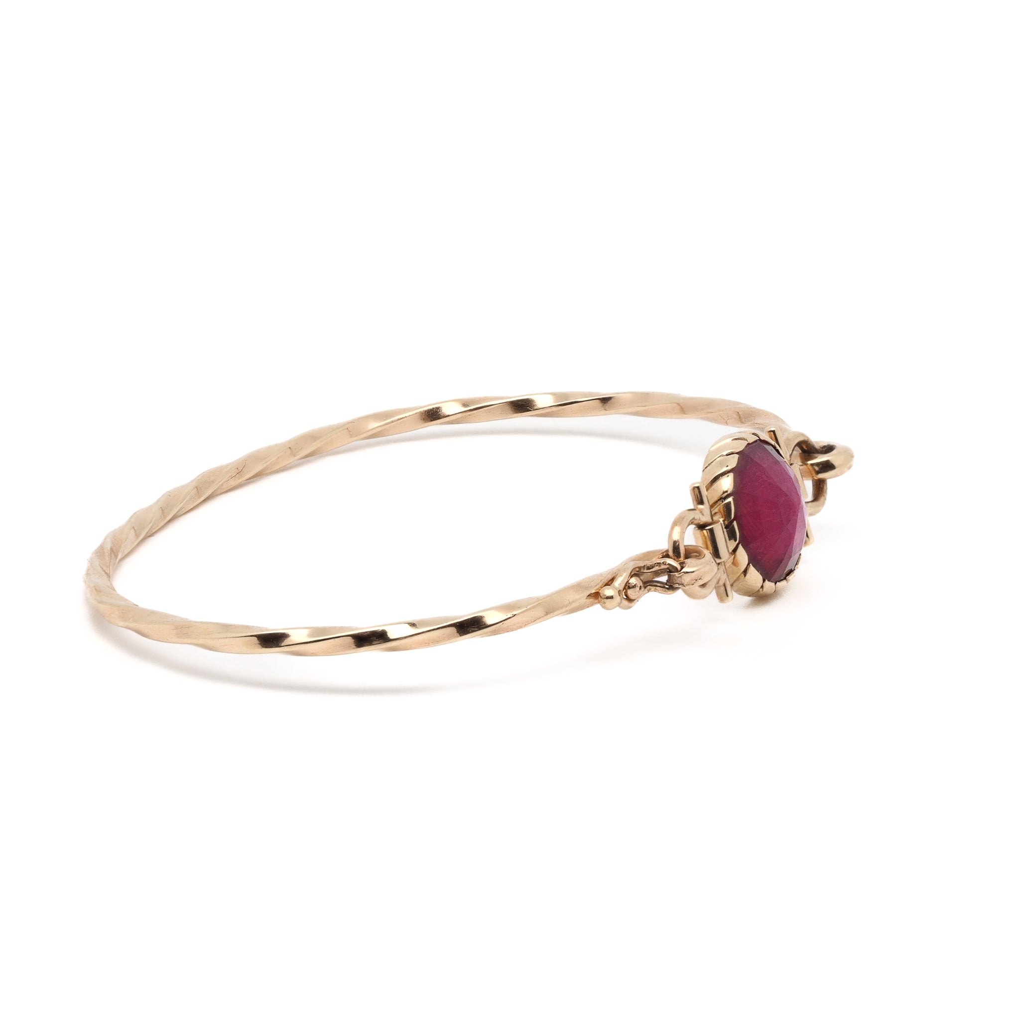 Handcrafted Gold Bangle with Ruby - A detailed image of the handcrafted Gold Ruby Bangle Bracelet, highlighting the intricate design and luxurious materials.