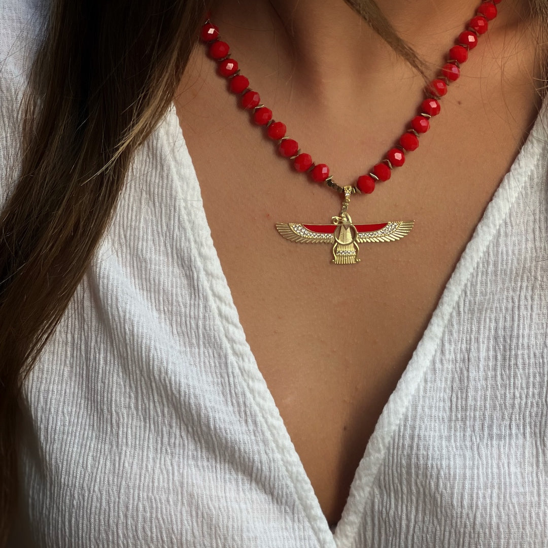 Embracing Symbolism - Our model showcases the Red Crystal Faravahar Necklace with Confidence.