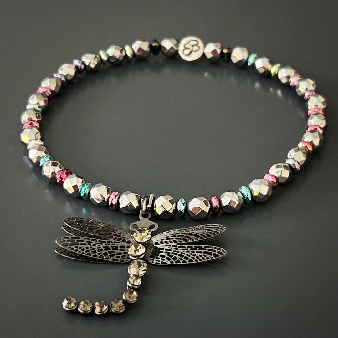 Add a touch of symbolism to your ensemble with the Self Love Dragonfly Anklet, crafted with silver hematite stone beads, blue and pink hematite spacers, and a silver dragonfly charm, reminding you to embrace personal growth and self-love.