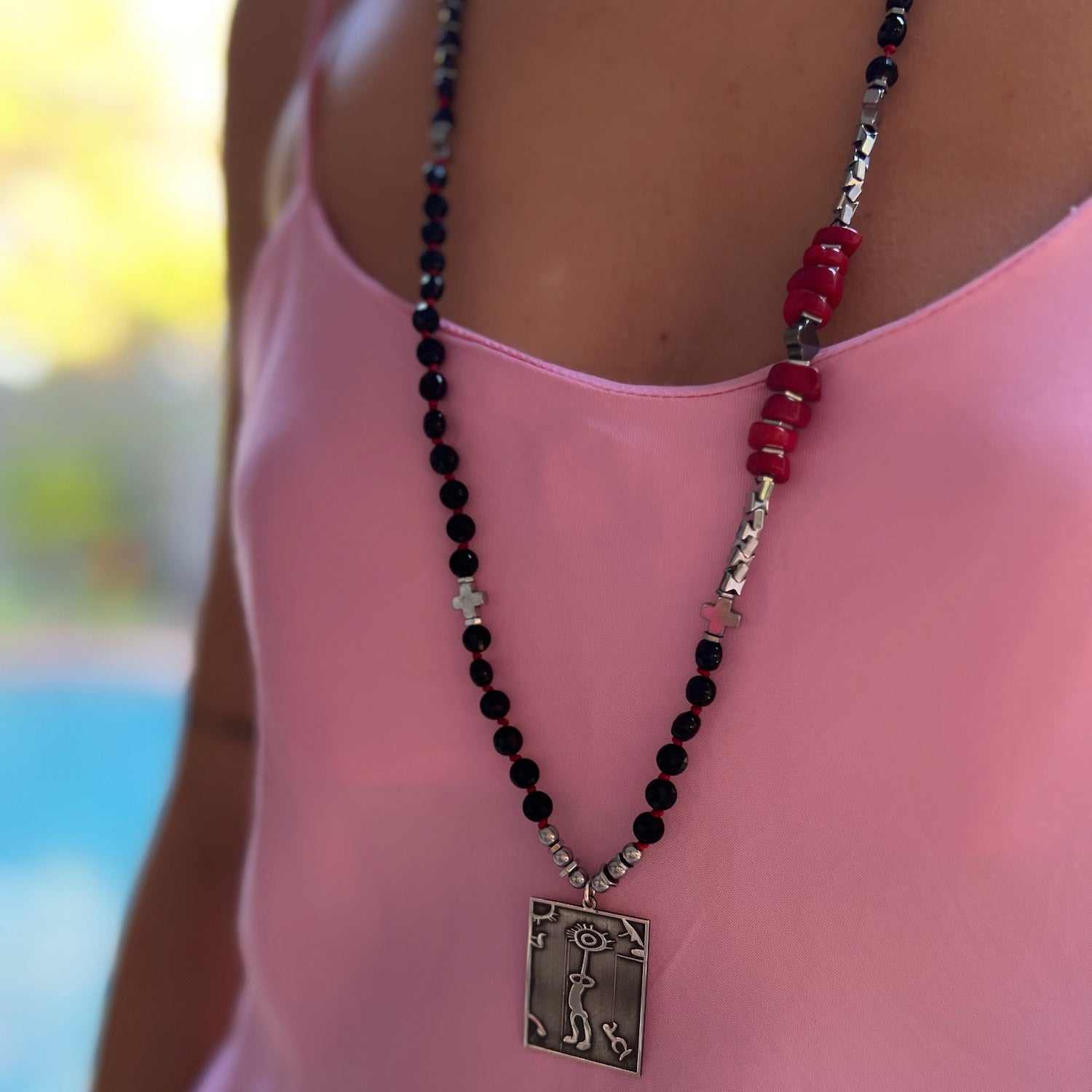Elevate your style with the Onyx and Red Coral Necklace - as seen on our model.