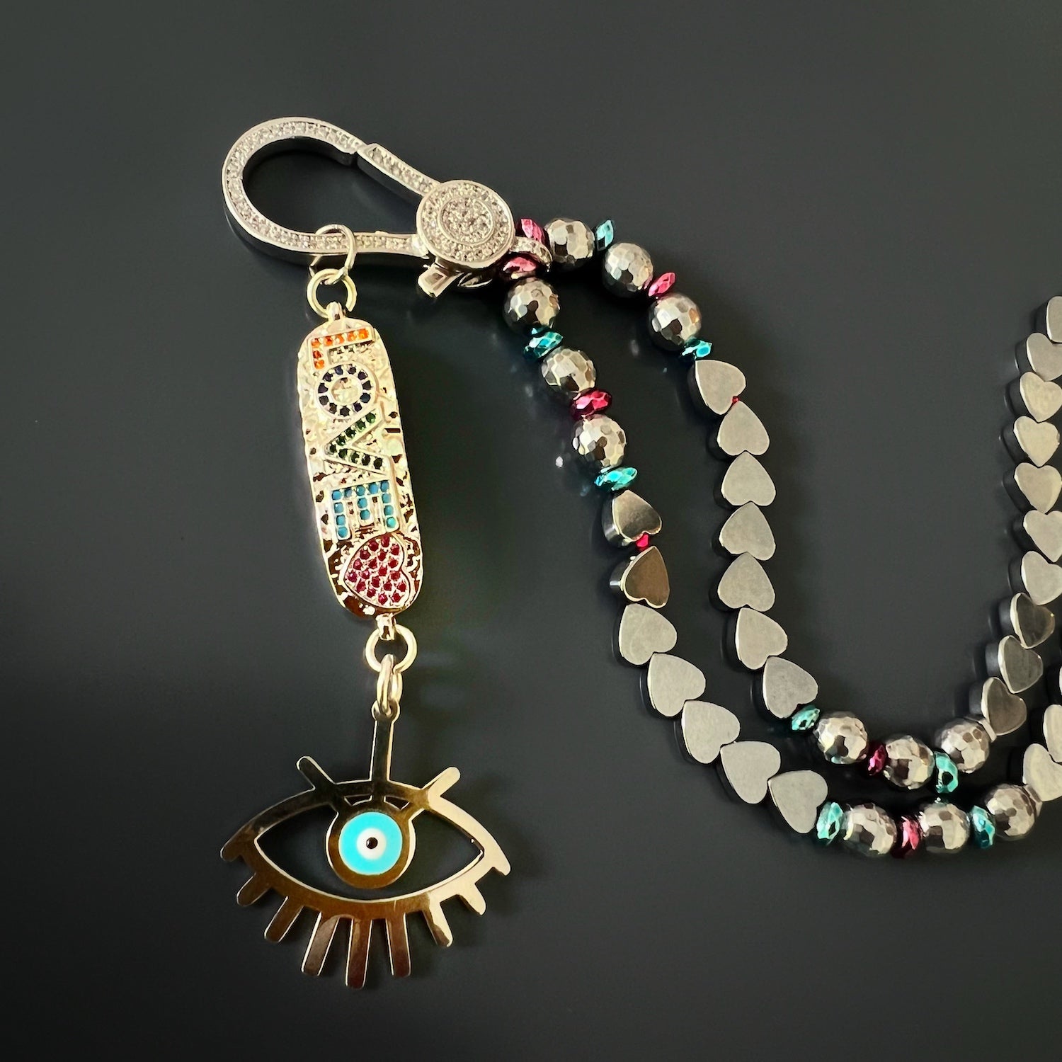 Close-up of the 925 Sterling silver evil eye charm with blue enamel on the necklace