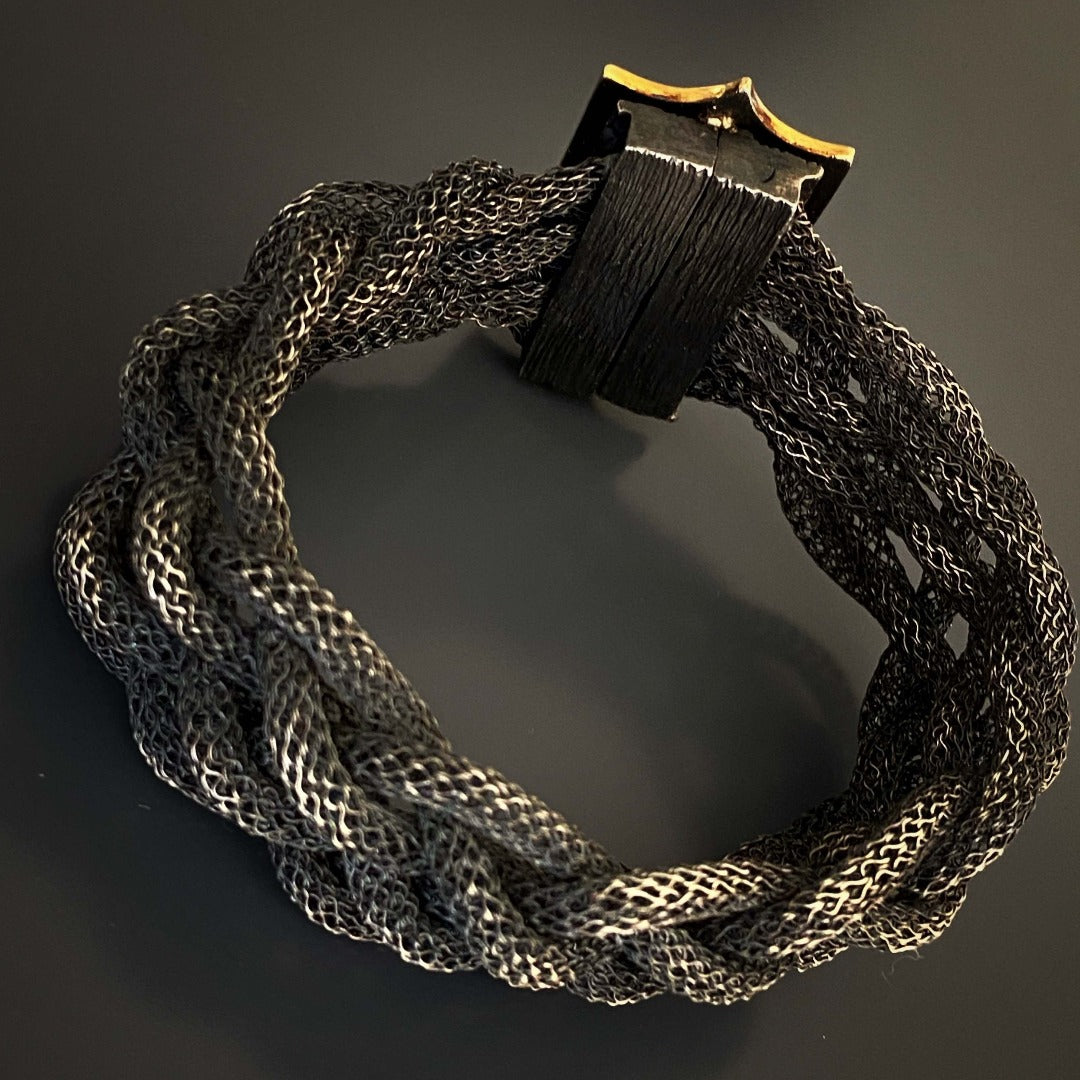 Celebrate the uniqueness of the Silver Braided Evil Eye Bracelet, a special piece that reflects your individual style and offers protection.