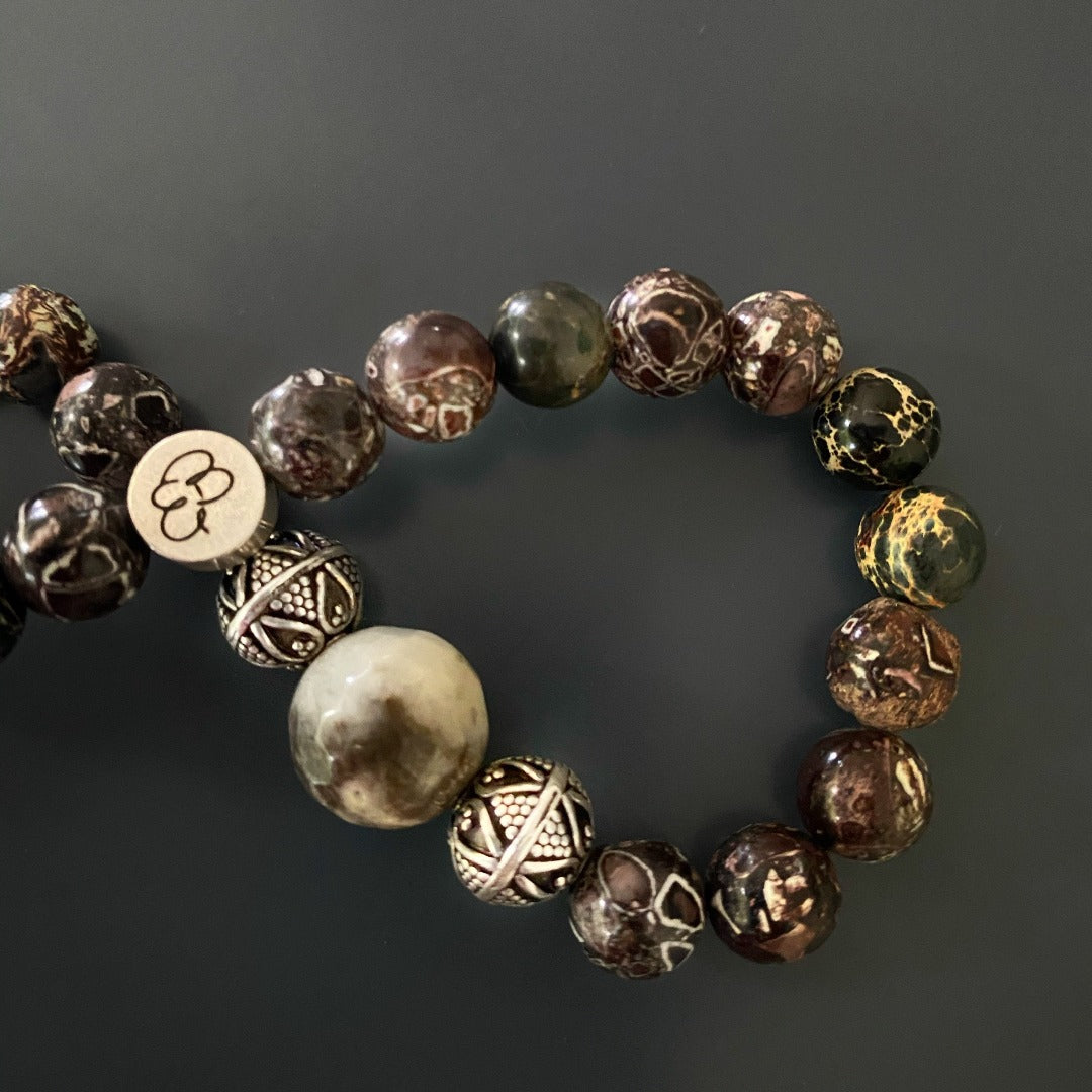 Unique style bracelet combining natural brown jasper stones and tribal silver elements.