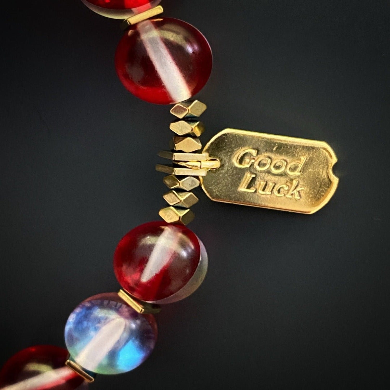 Admire the unique craftsmanship of the Red & Gold Good Luck Bracelet, showcasing its intricate details and captivating design.