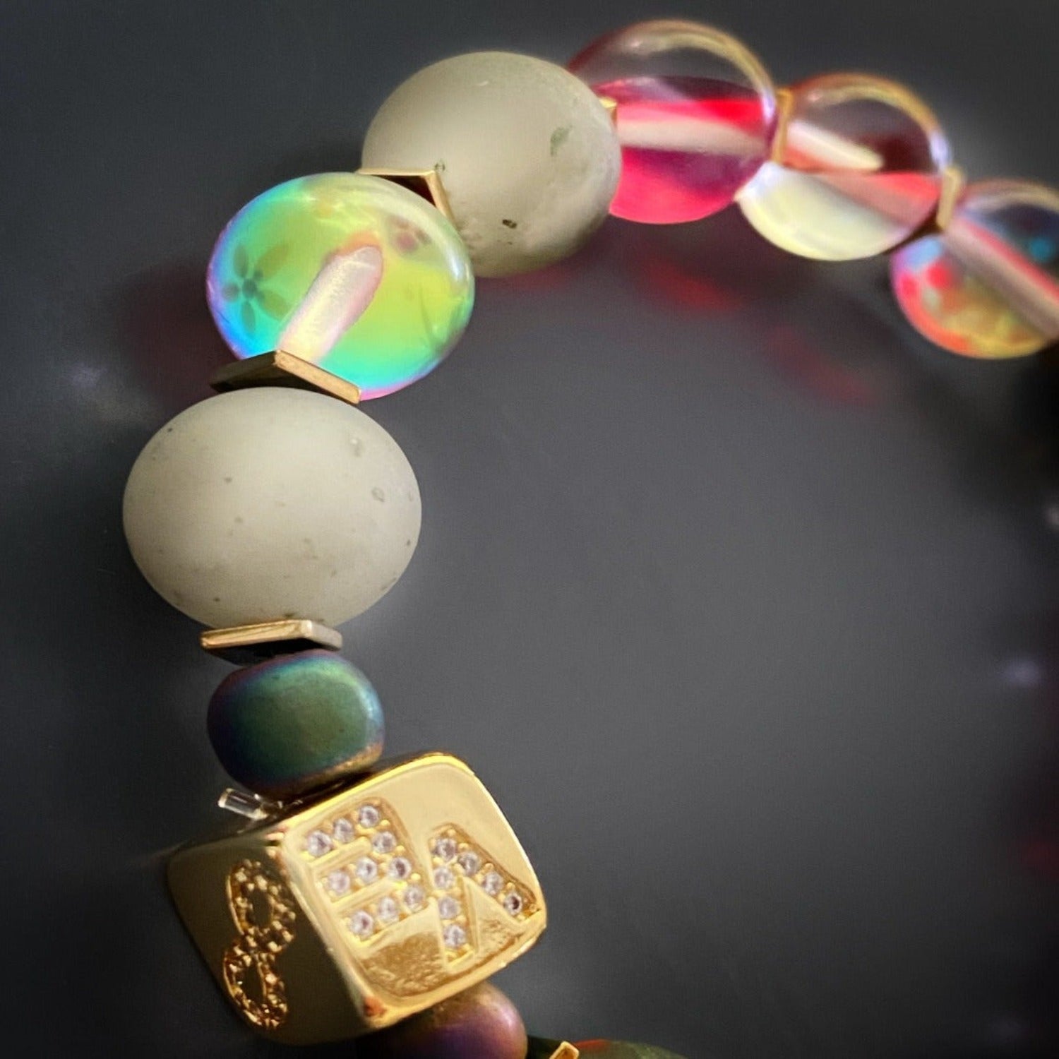 Experience the positive vibes of the Red & Gold Good Luck Bracelet, featuring a gold-plated bead and a symbol of good fortune.
