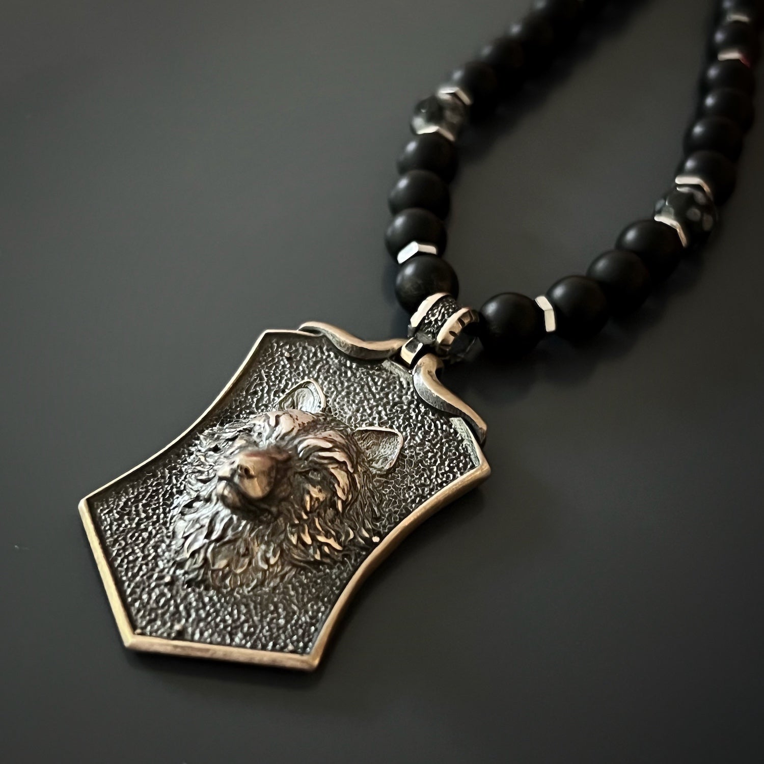 Immerse yourself in the symbolism of the Spirit Onyx Wolf Necklace, handcrafted with attention to detail and meaning.