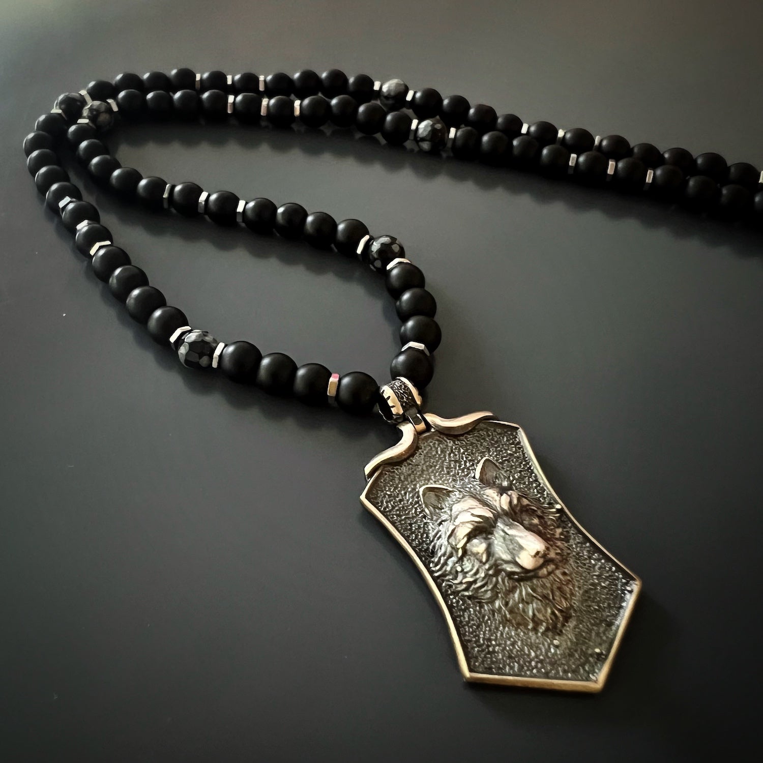 Celebrate your individuality with the Spirit Onyx Wolf Necklace, a handcrafted piece that represents inner strength and loyalty.