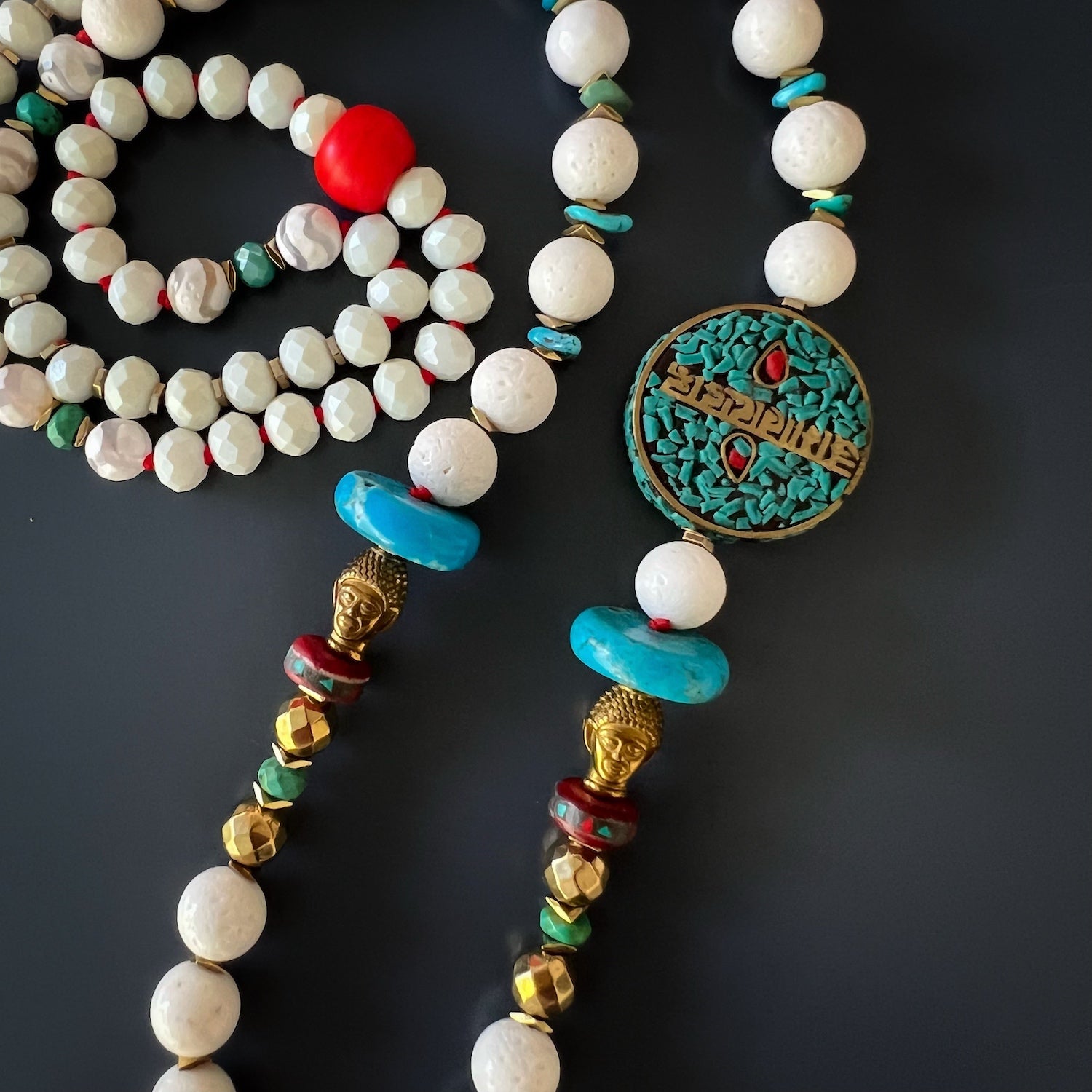 Symbol of Compassion: Nepal Om Mani Padme Hum bead, a centerpiece of the Mantra Necklace.