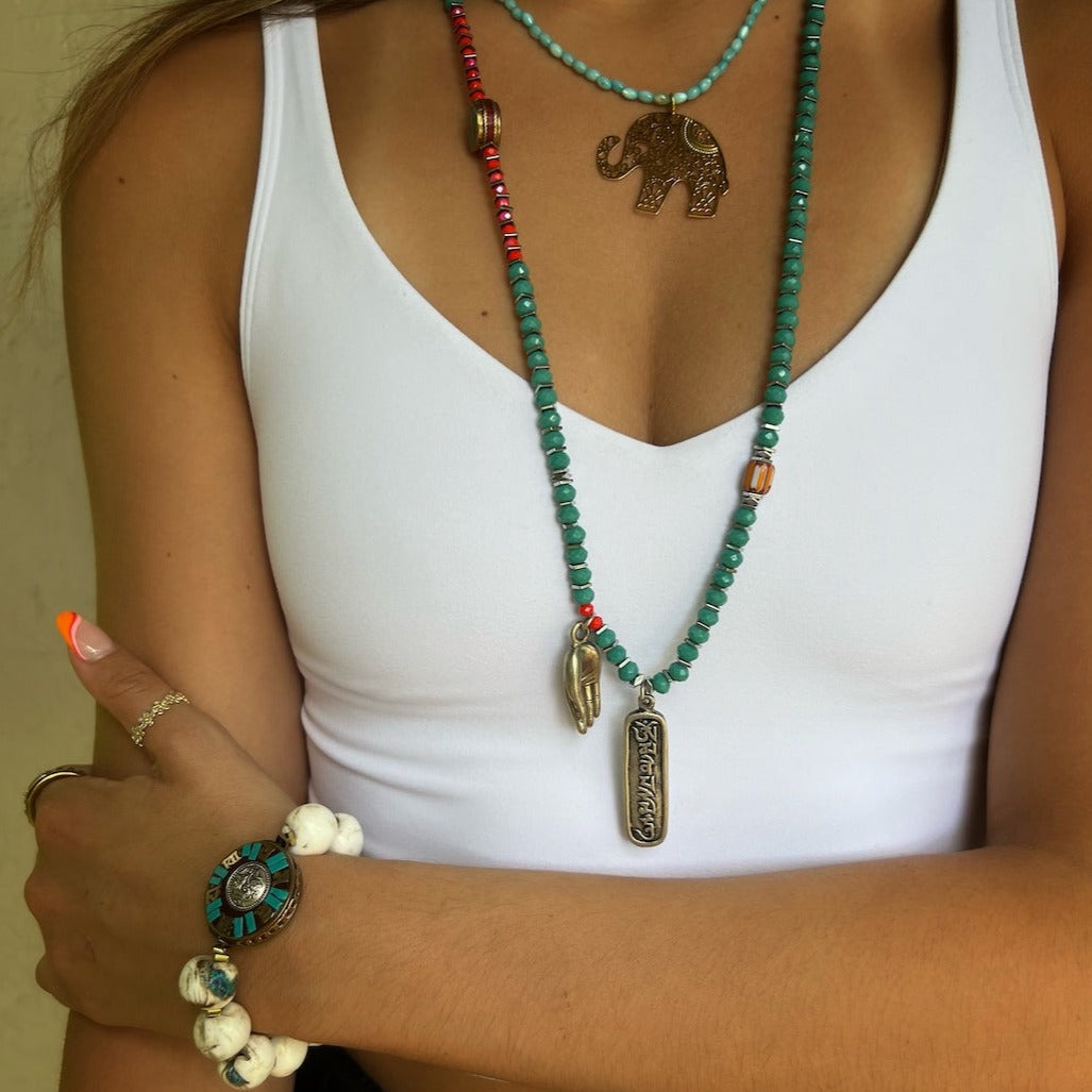 Model wearing the Spiritual Om Yoga Necklace, exuding peace and tranquility.