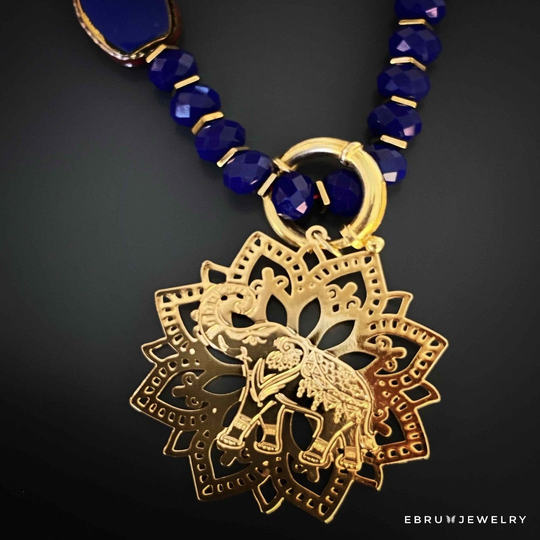 Experience the captivating aura of the Spiritual Elephant Necklace, crafted with care and adorned with symbolic charms for luck and protection.