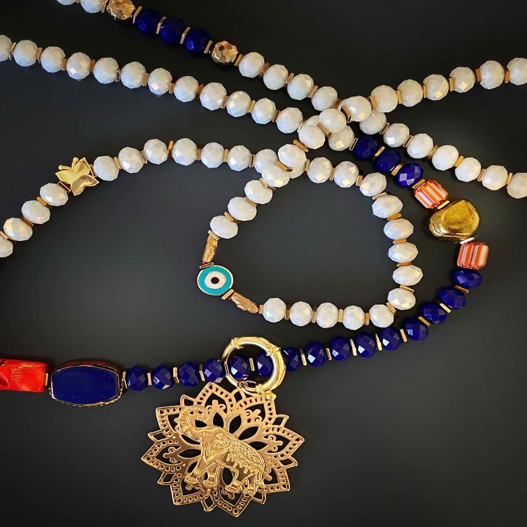 The Spiritual Elephant Necklace radiates positive energy and grace, with its lucky elephant pendant and eye-catching evil eye charms.
