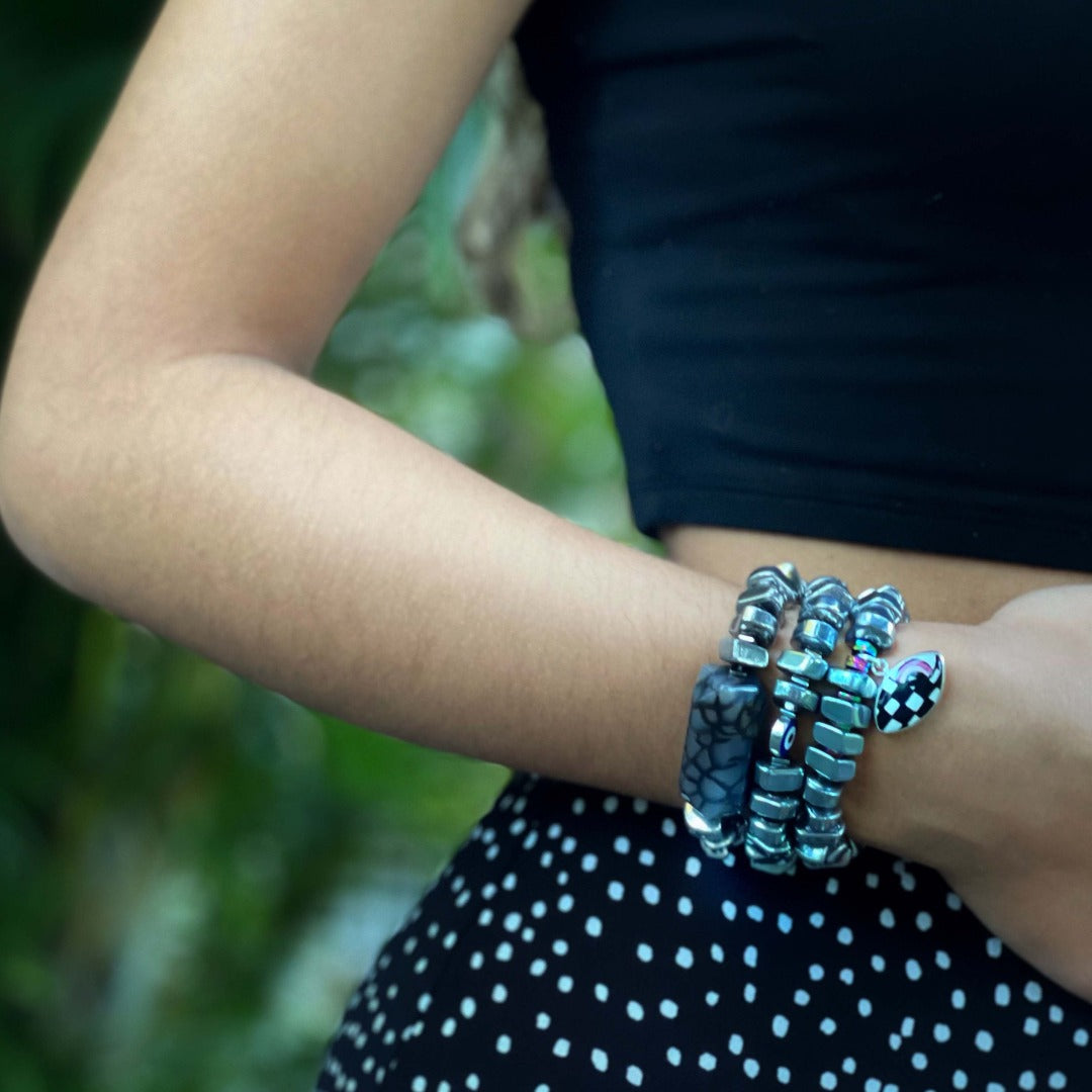 The model exudes wearing the Stylish Mila Bracelet, a chic accessory that complements her style with its boldness.
