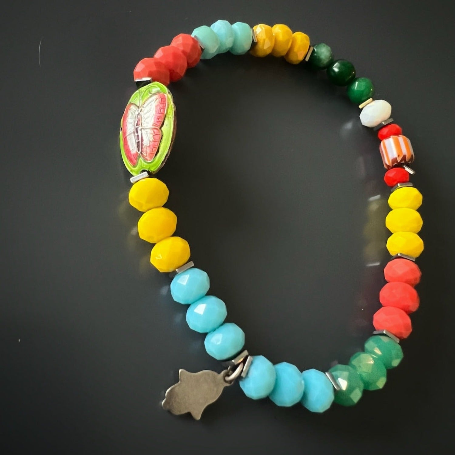 Boho-inspired anklet with faceted crystals and charm details.