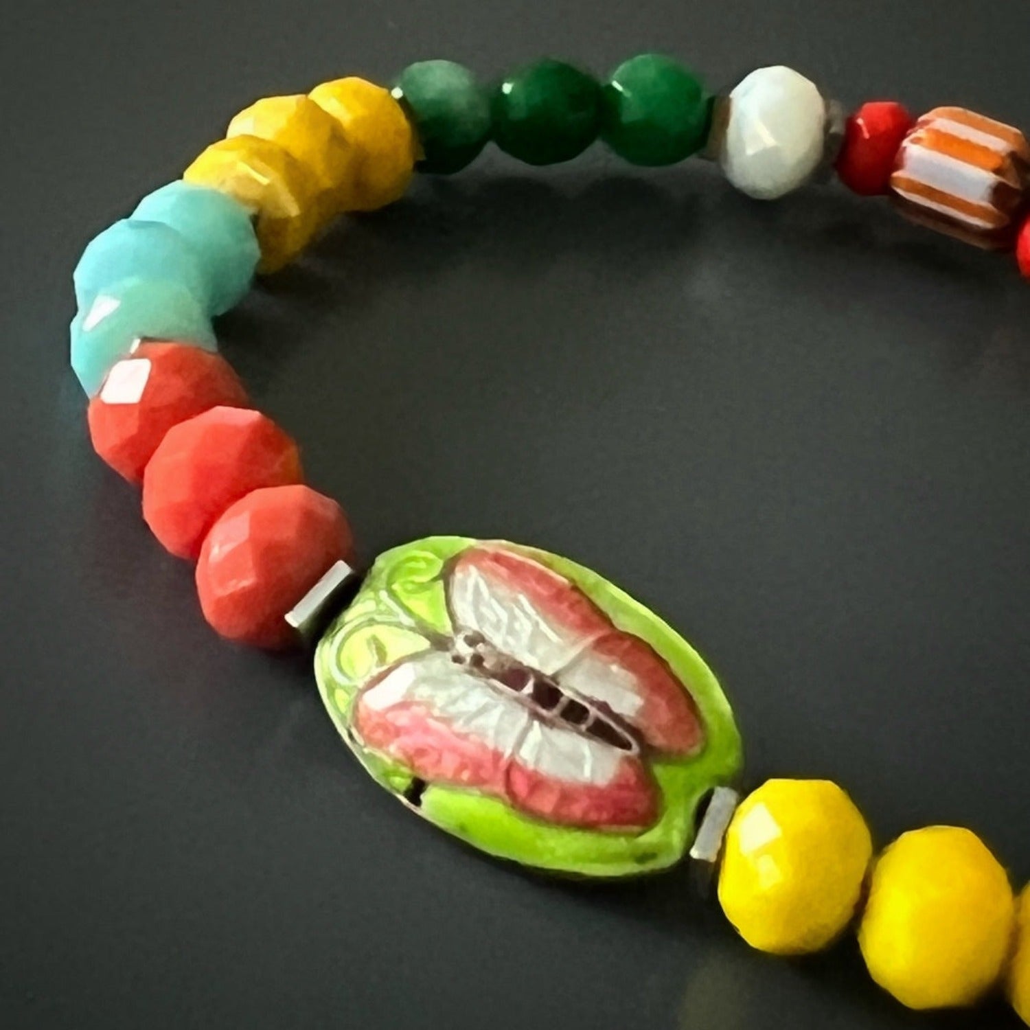 Silver hematite spacer anklet with joyful summer colors and symbolic charms.