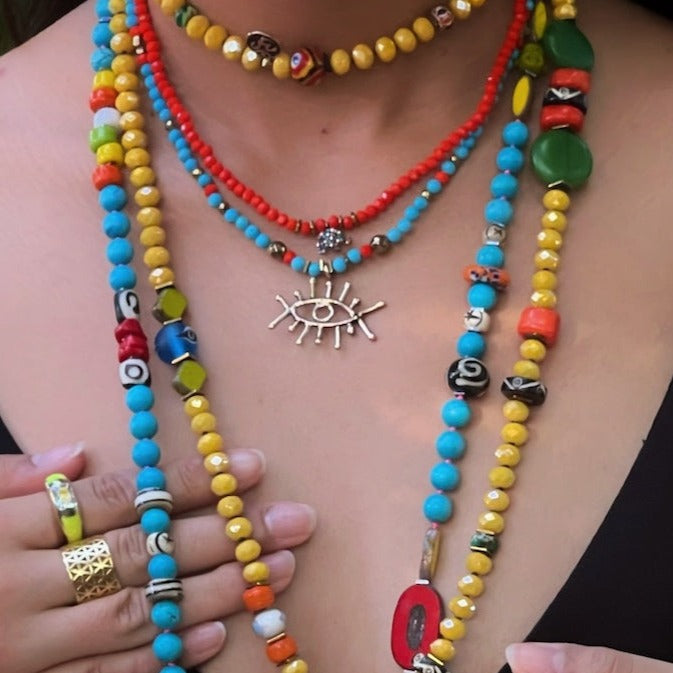 Model showcasing the Turquoise Guardian Necklace - a blend of style and positive energy.