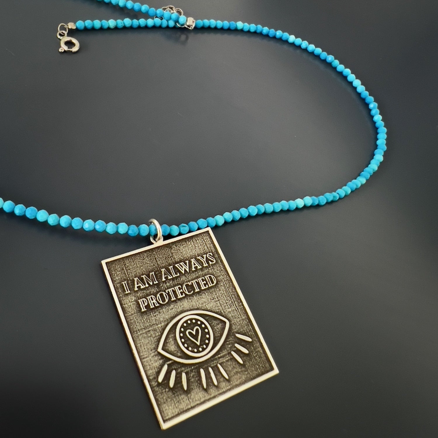 The tranquil beauty of the Turquoise stone in the Turquoise 'I Am Always Protected' Necklace