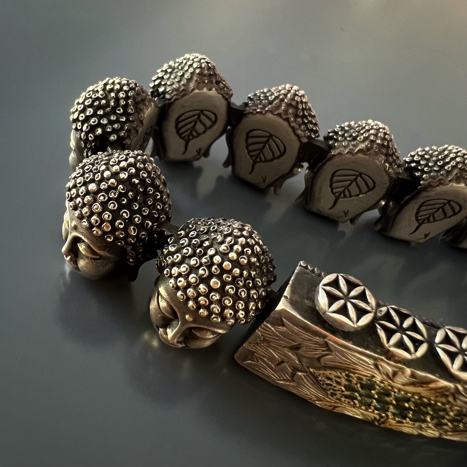 Meaningful Symbol - Buddha Peace Bracelet with an engraved peace sign.