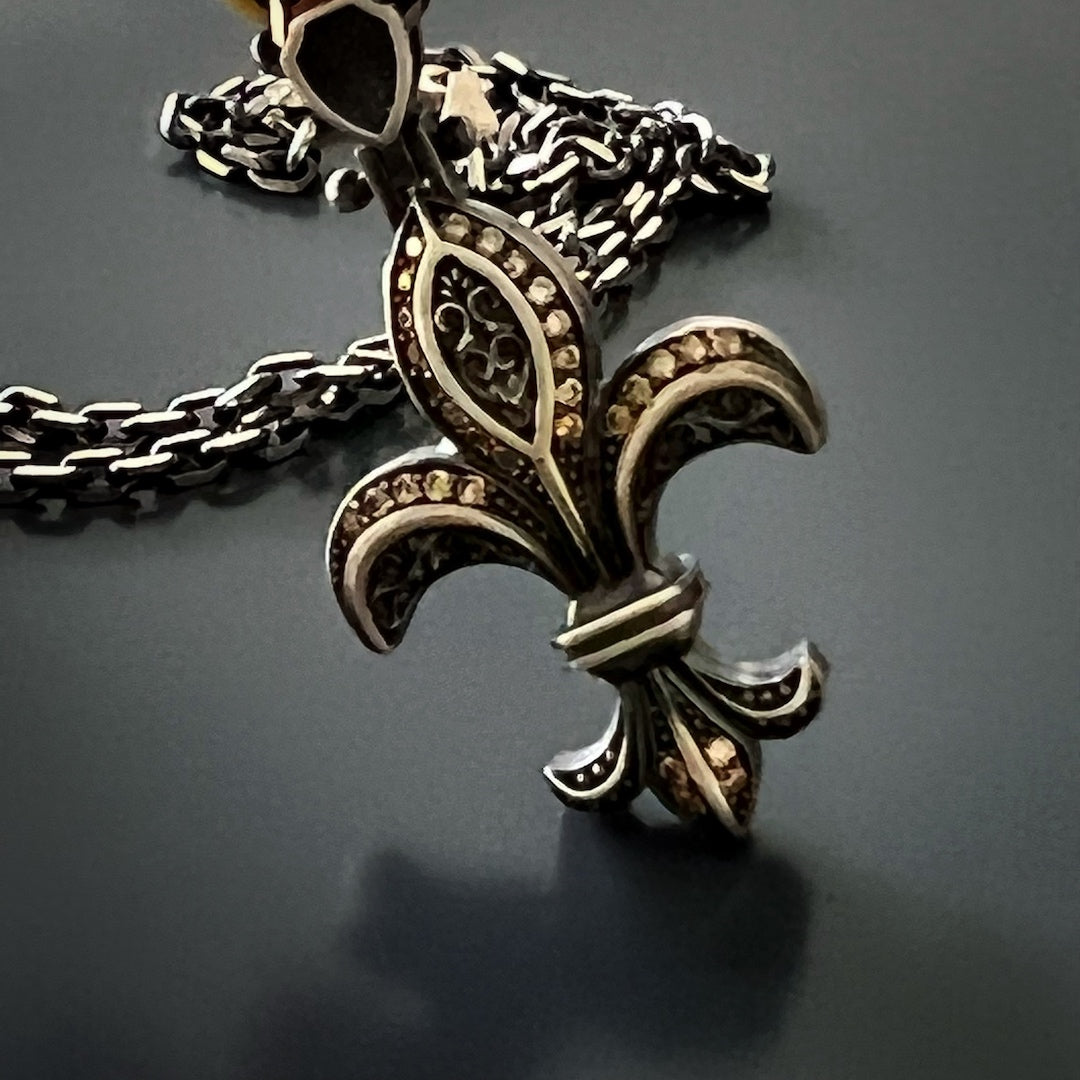 Express your individuality with the Unique Designer Fleur de Lis Necklace, a testament to your unique style and appreciation for fine craftsmanship.