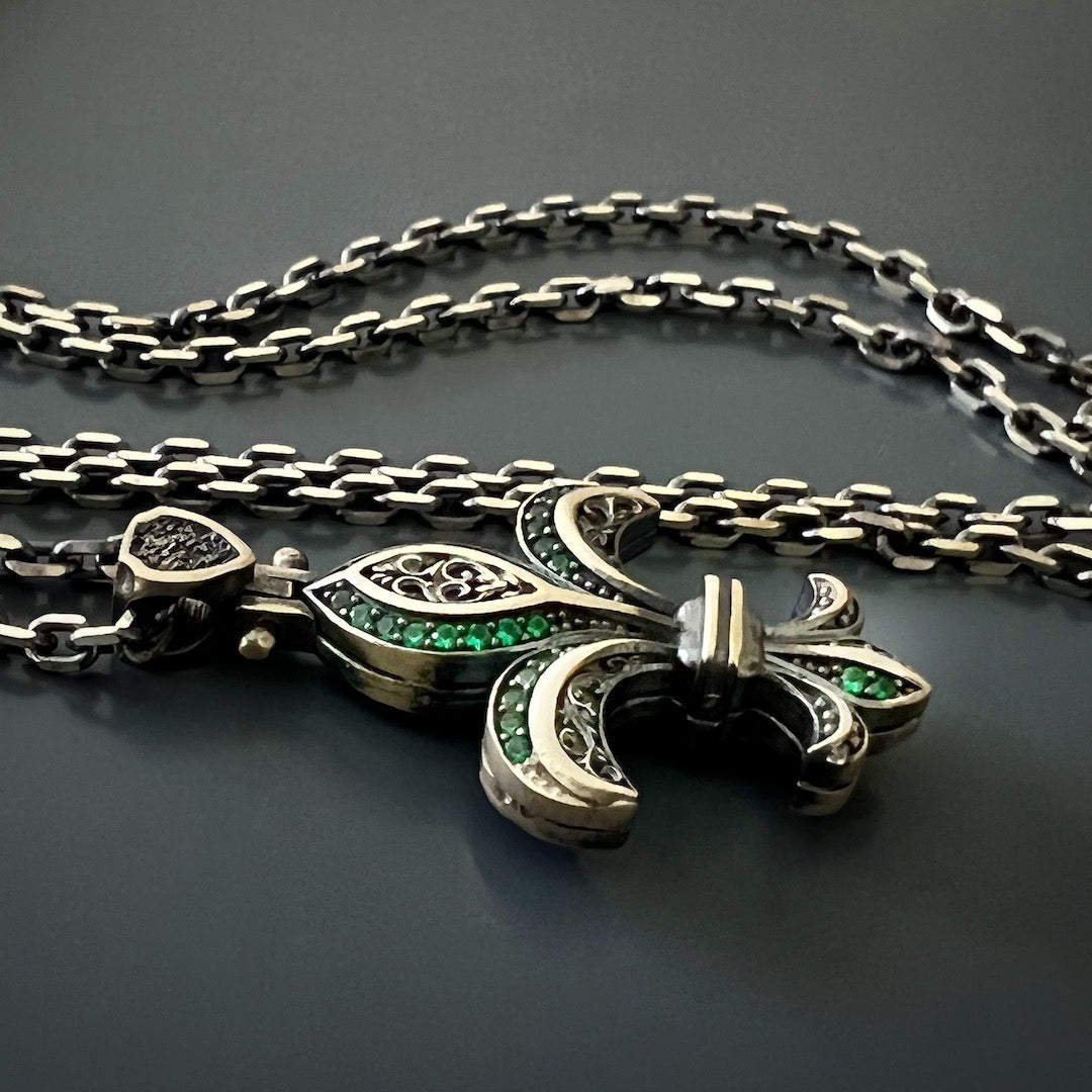 Experience the craftsmanship and artistry of the Unique Designer Fleur de Lis Necklace, meticulously hand-carved and adorned with stunning zircon stones.