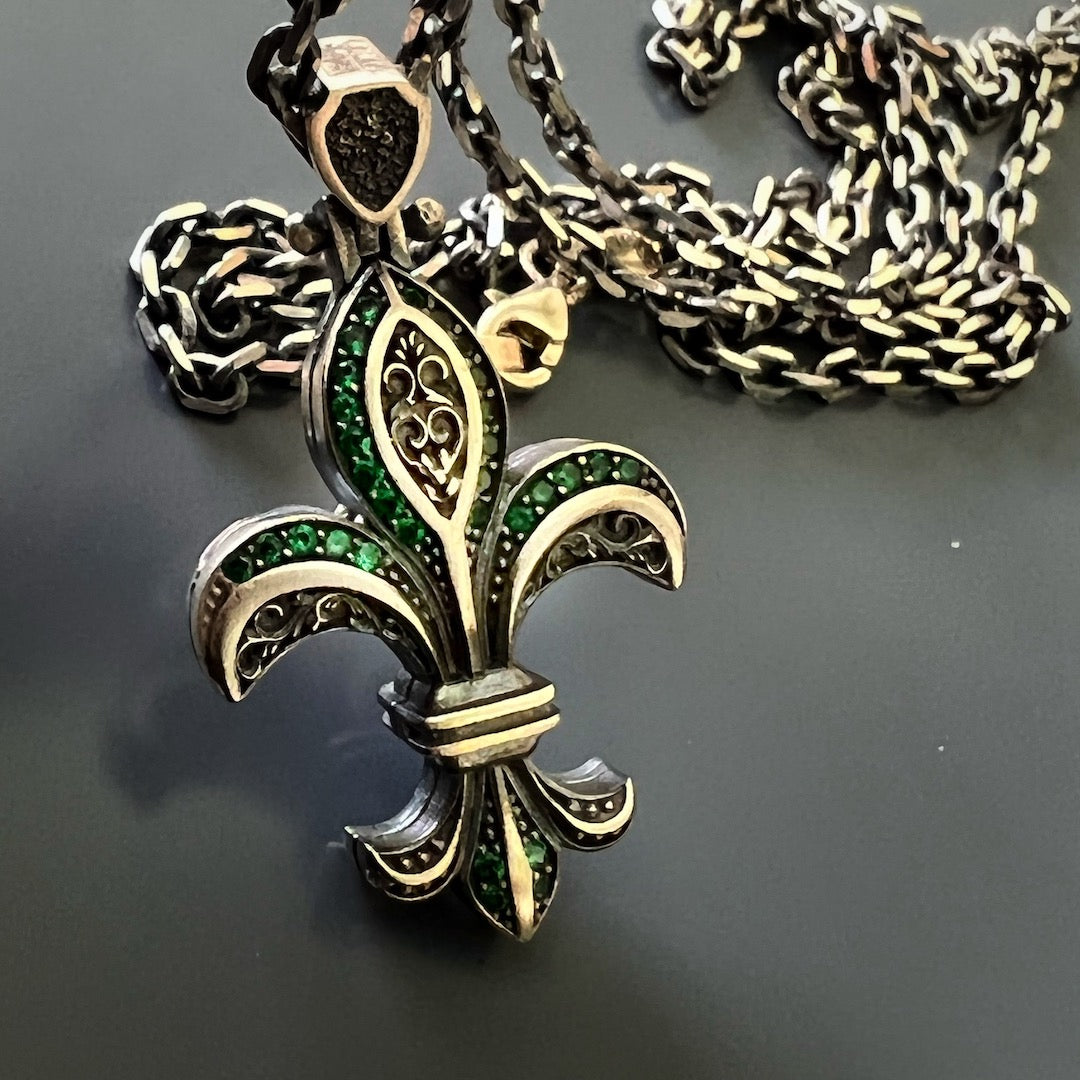 The Unique Designer Fleur de Lis Necklace combines intricate design and vibrant gemstones, creating a truly remarkable piece.