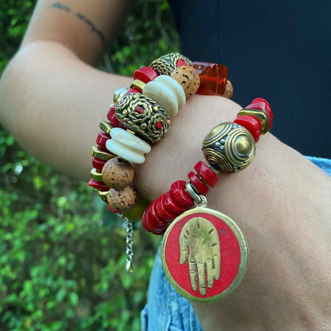 The model exudes bohemian elegance while wearing the Vintage Style Bohemian Bracelet, showcasing its vibrant colors and unique beadwork.