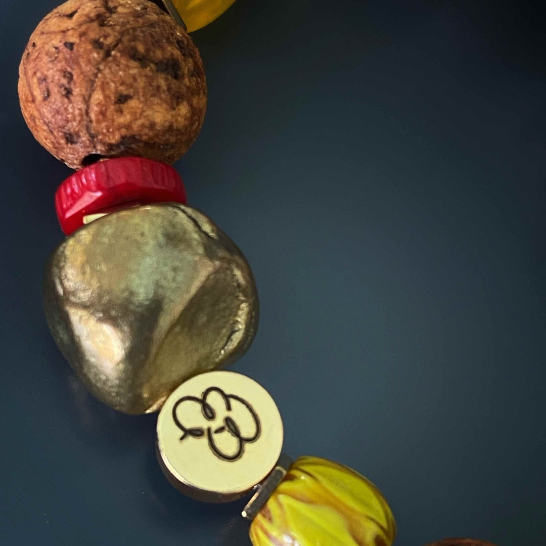 Discover the handmade beauty of the Vintage Style Bohemian Bracelet, featuring a mix of Nepal seed beads, Tibetan bone beads, and African beads.