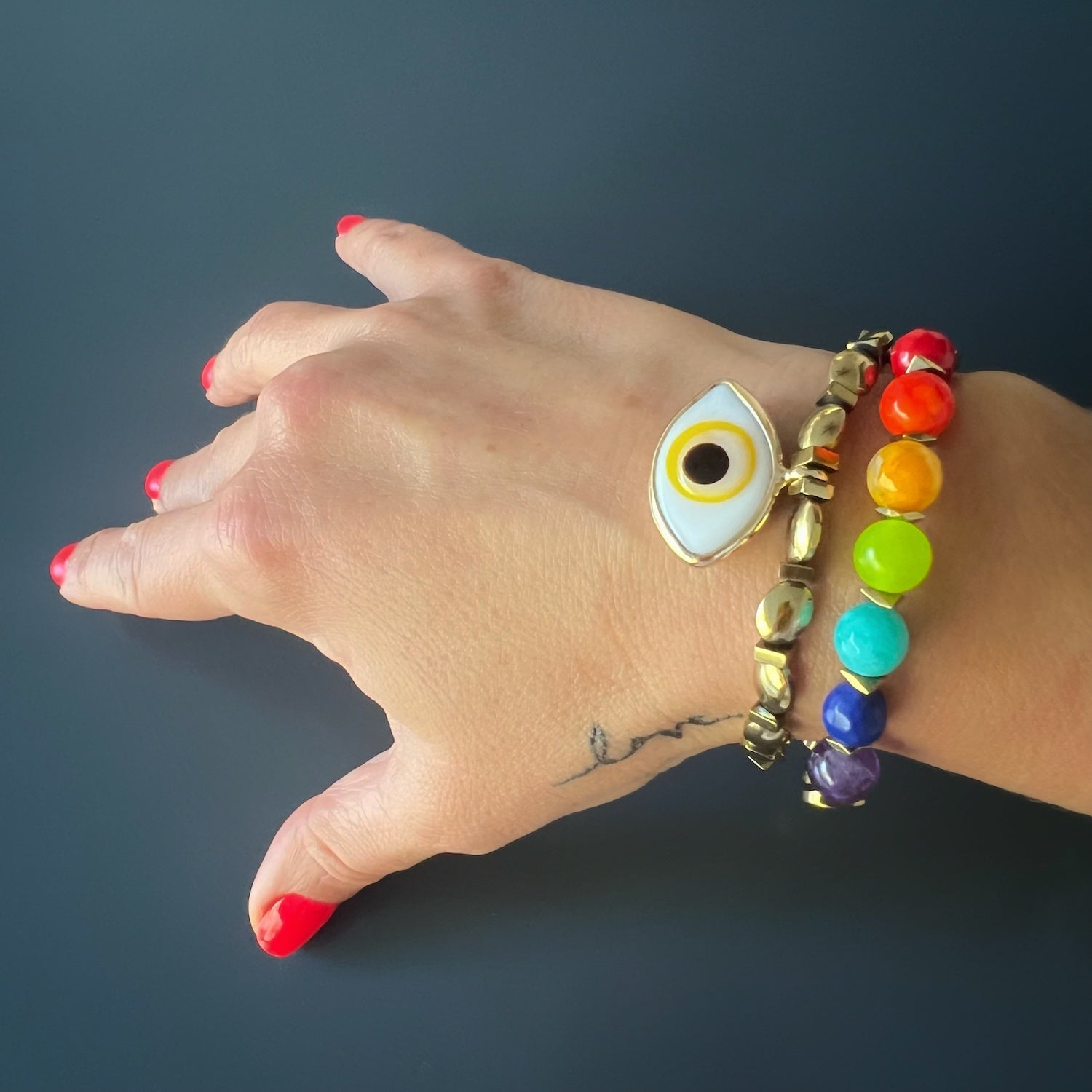 With the Yellow Evil Eye Bracelet on her wrist, the hand model embodies the elegance and power associated with this unique accessory.