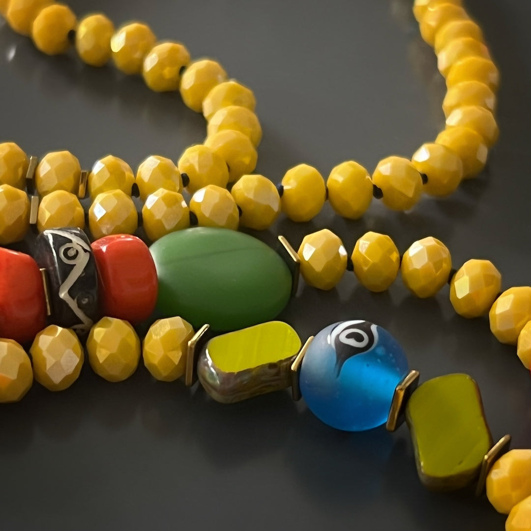 Unique Yoga Serenity Necklace featuring Om Mantra, Buddha Eyes, and evil eye beads.