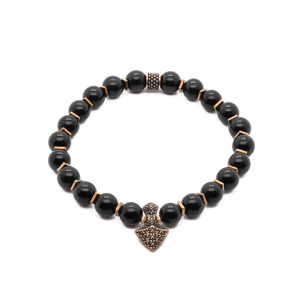 Black onyx men’s bracelet with bronze arrowhead charm and gold hematite spacers, handmade.